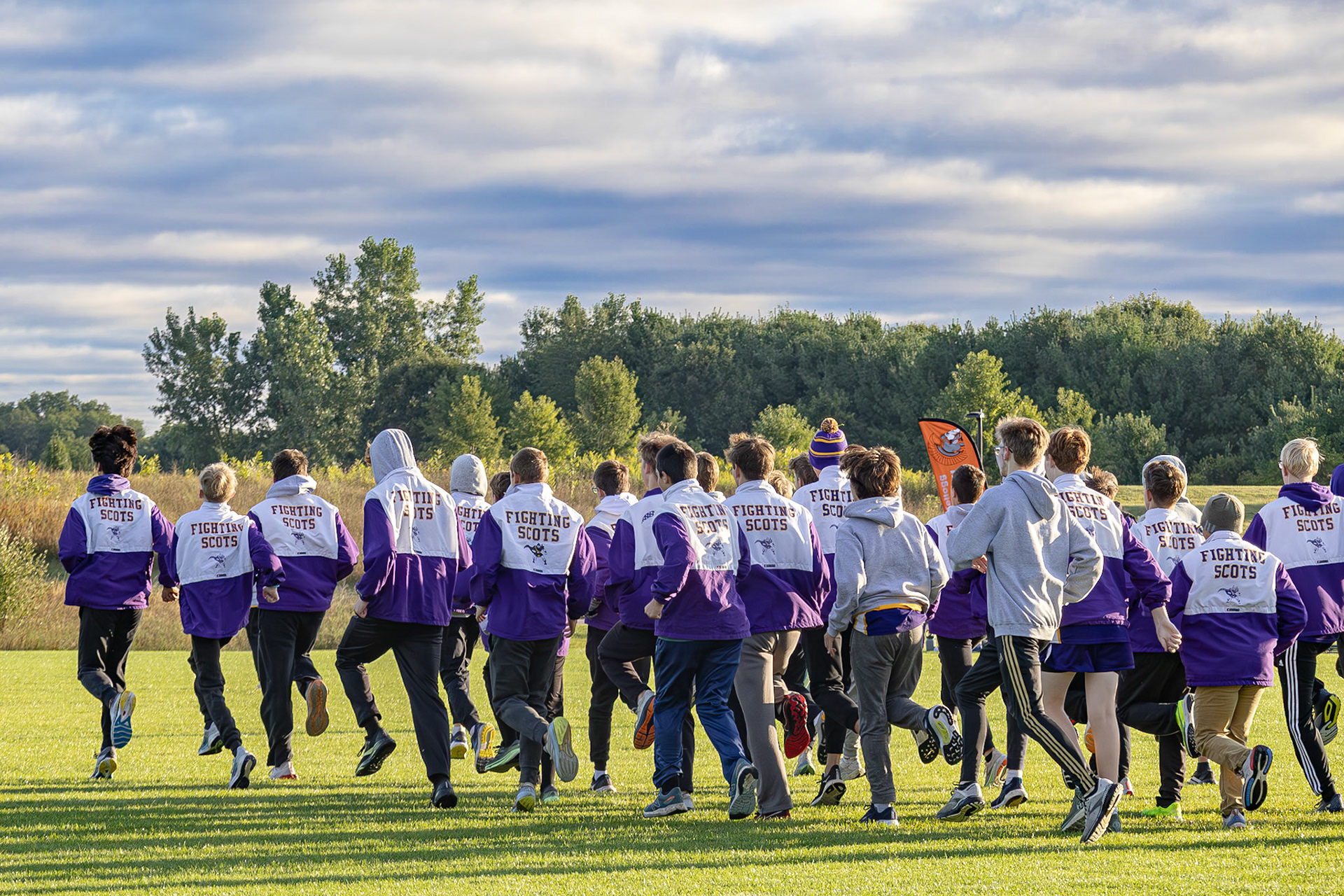 POWER UP! The Boys Cross Country team warms up for the meet against Thornapple-Kellogg. (Photo by Caralyn Price)