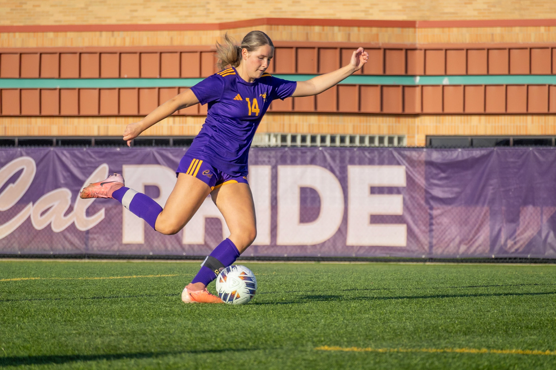 Kortney Muller kicks the ball in a solo moment on the field. (Photo by Ava LaBine)