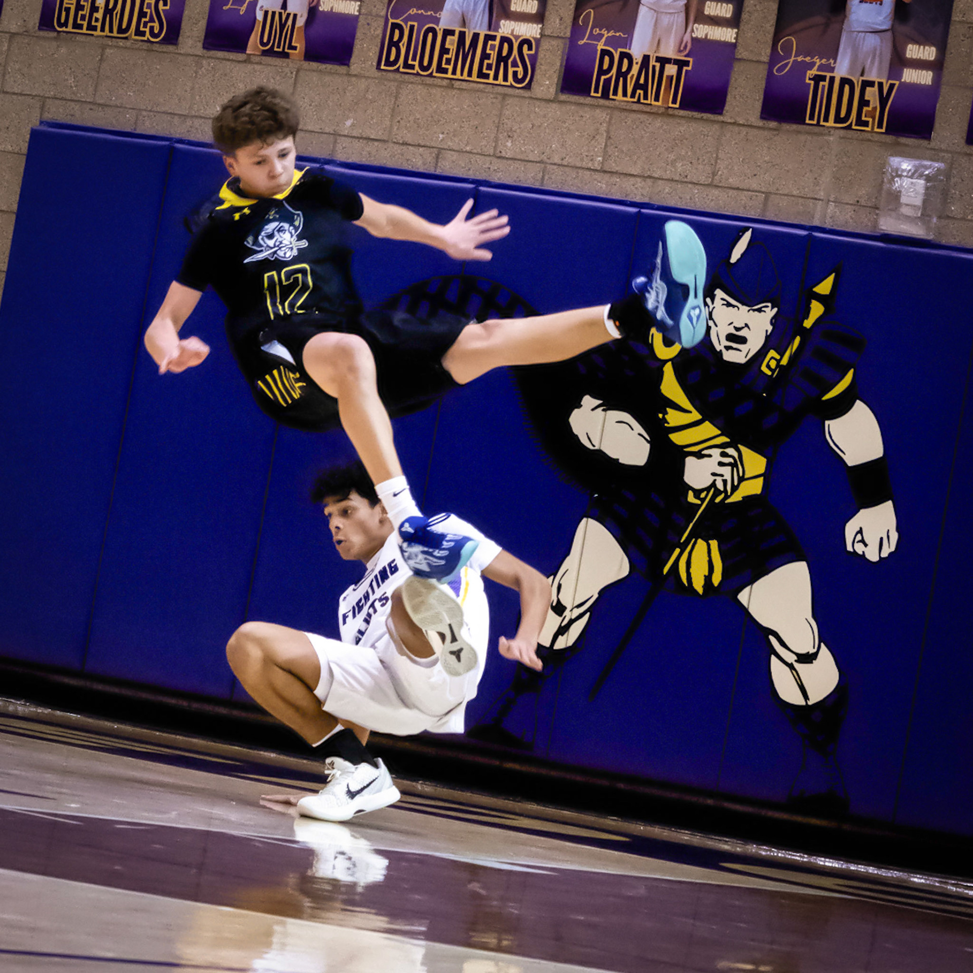 TOUGH KID Jaden Emerson takes a charge, putting his body on the line to get his team the ball back and put them in a strong position. (Photo by Jeremiah Pittman)