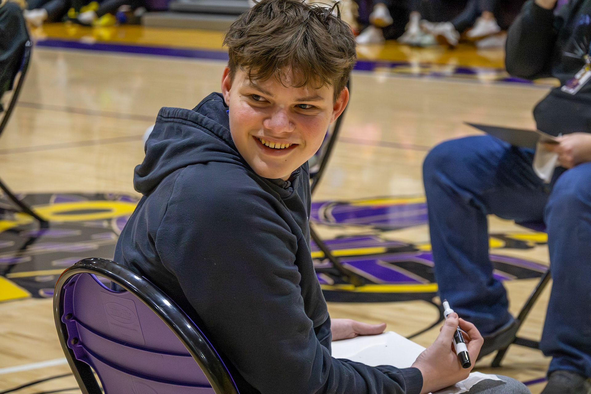 Joey Duvall proves the Gen Z vs. Millennial game is more fun with friends by his side, helping him tackle each question. (Photo by Lilli Jackson)
