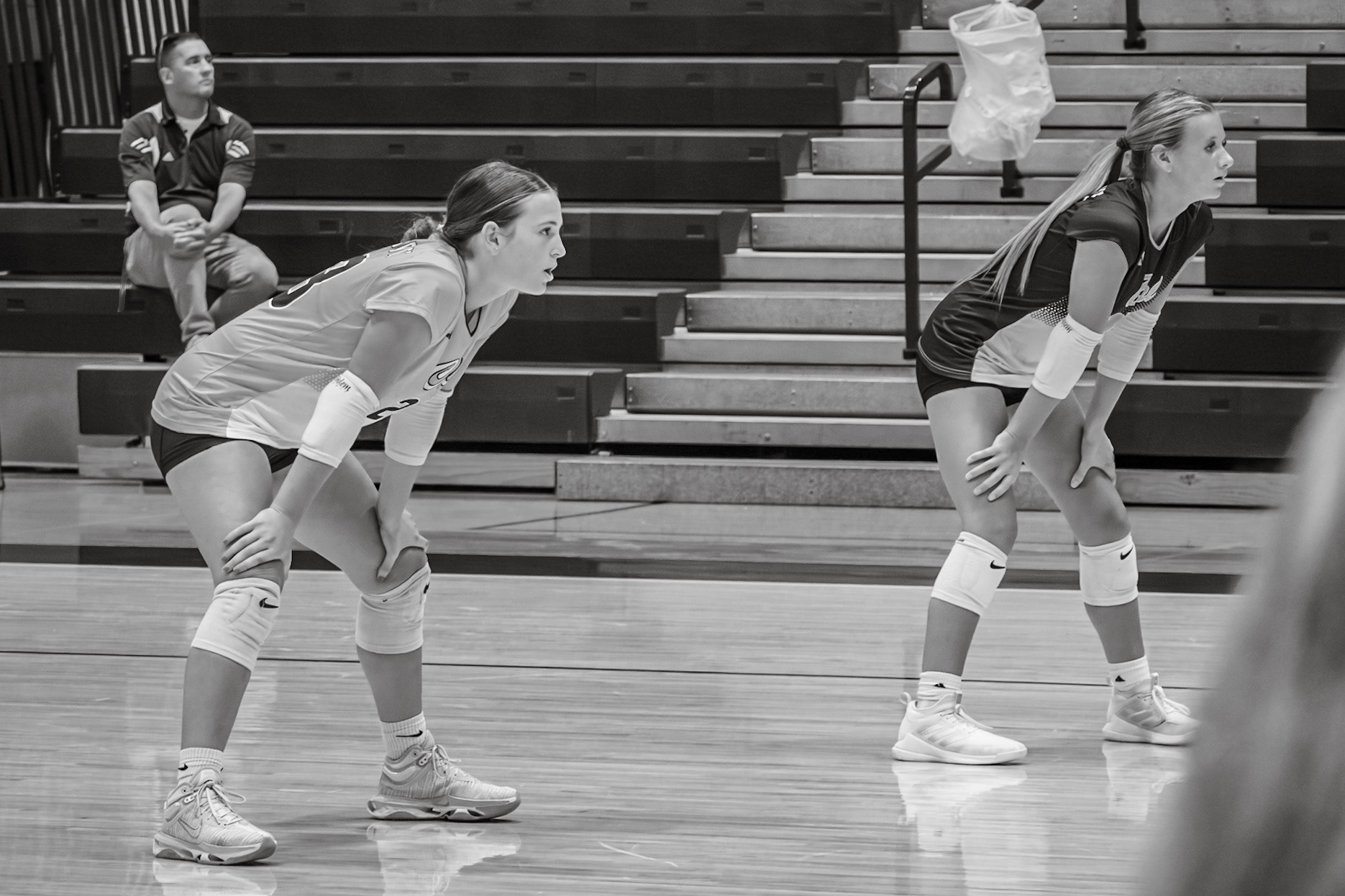 As Aimee Poe and Brooke Haynes get set for their game against Reeths Puffer, distractions fade and determination takes over. (Photo by Khloe Lowande)