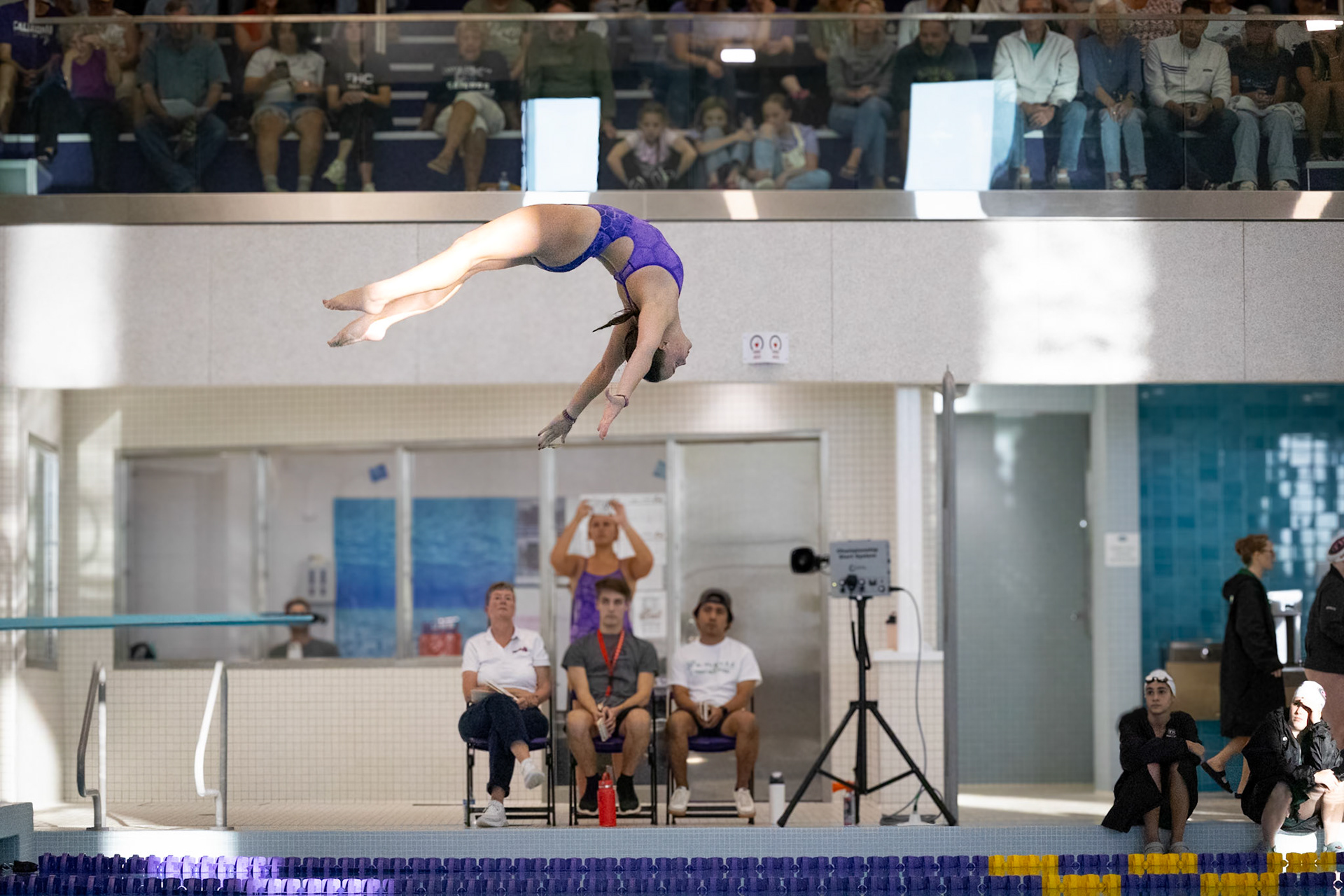 DIVE OF THE DAY  Lily Smith nails a stunning backflip off the diving board at a home meet against the Forest Hills Central Rangers. (Photo by Lena Gesing)