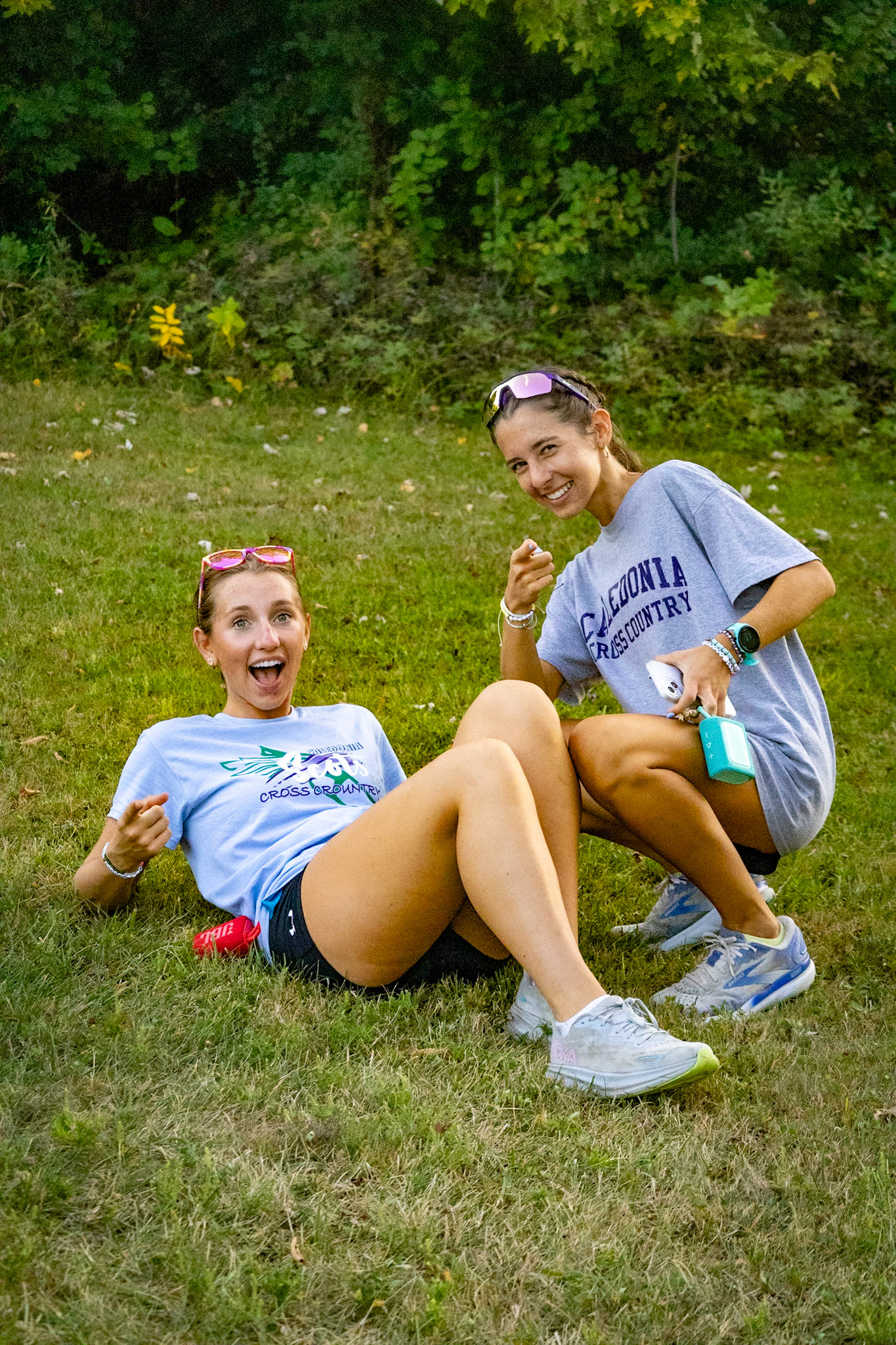 Alumni Keira and Kiley Bommarito return to support this year’s runners on the sidelines.(Photo by Akaela Daman)