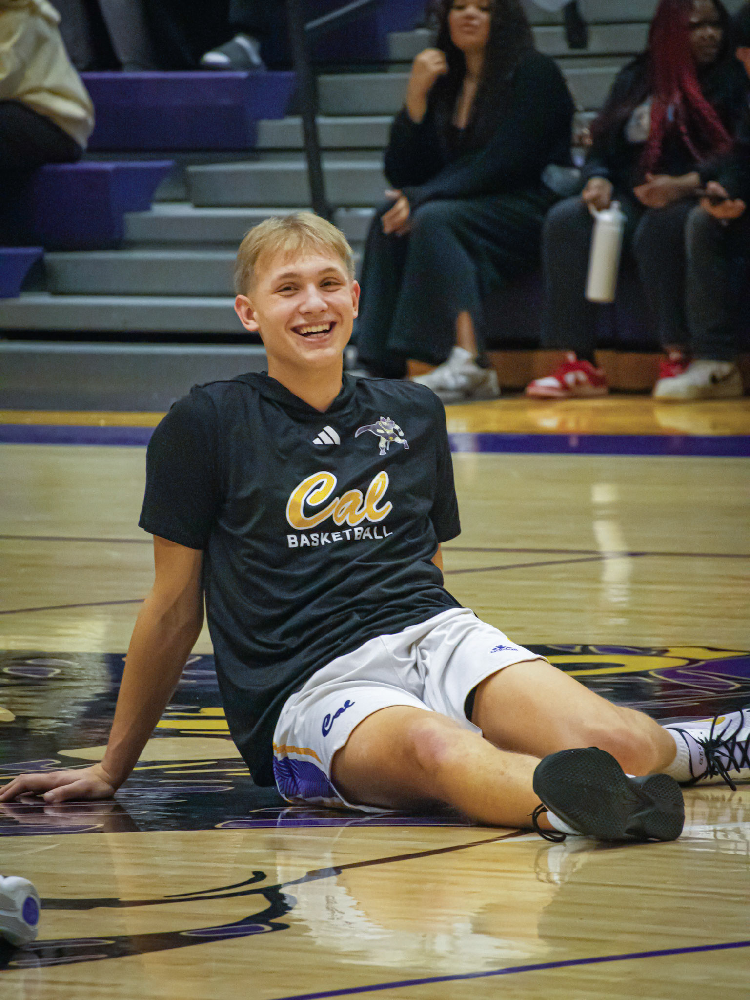Byrce Backus completes his pregame stretch, ready to beat Thornapple-Kellogg. (Photo by Jeremiah Pittman)