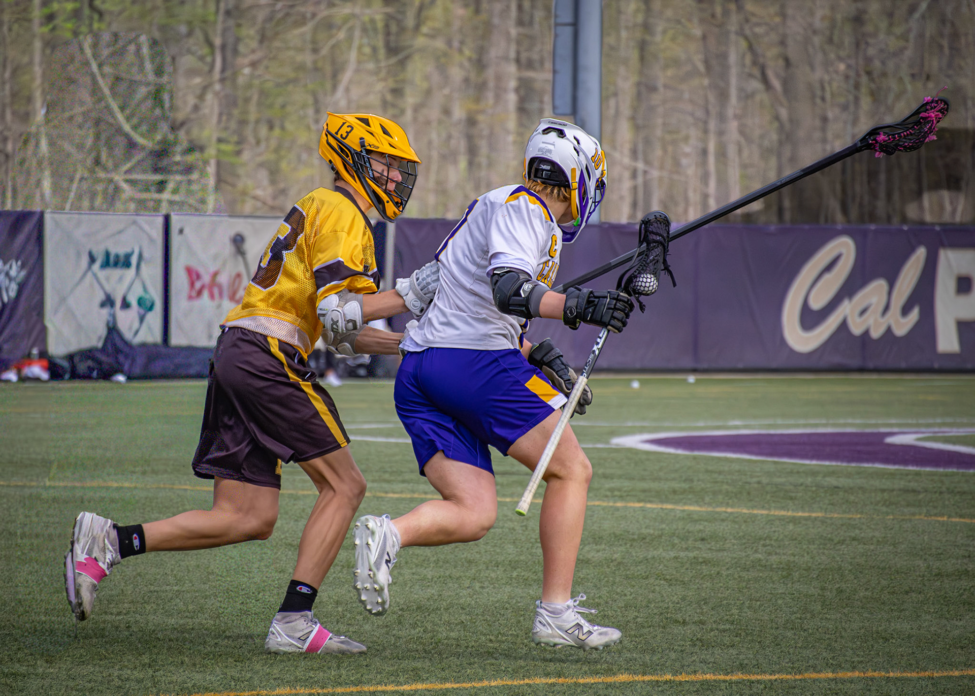 Senior Rylan Bultema fights past a Birmingham defender as his jersey is pulled from behind. (Photo by Avarey Lippert)