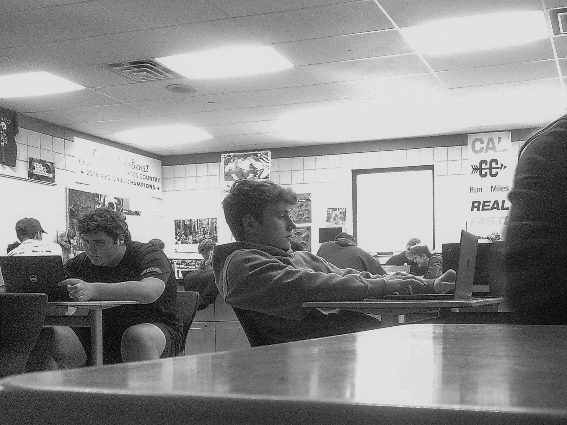 Environmental Studies students Noah Wert and Isaac Lange work on their presentations exploring how various food production methods impact the environment. (Photo by Abby Skibinski)