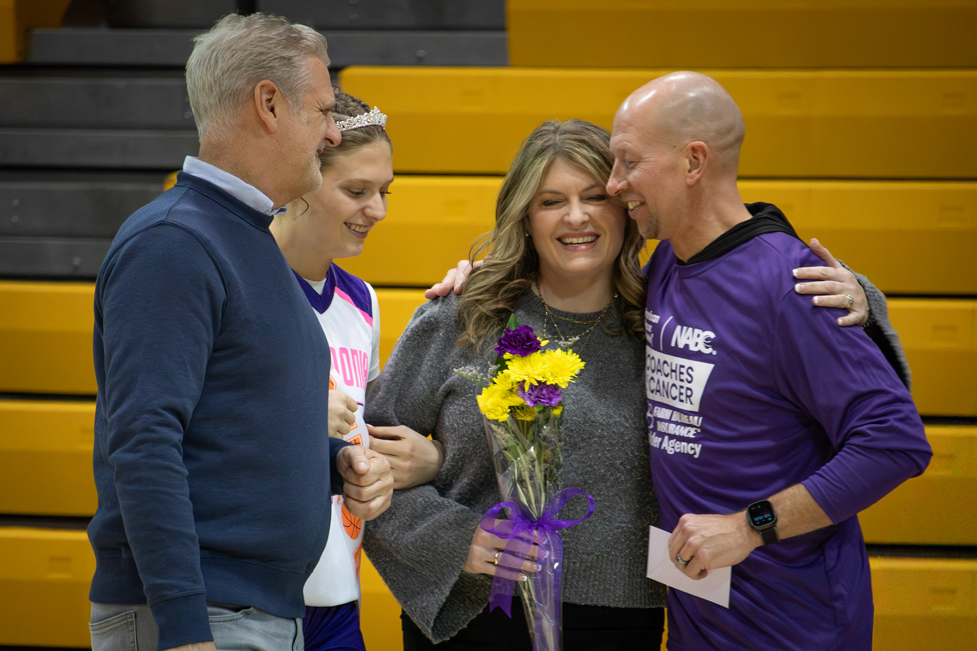 Jenny King embraces girls head coach Todd Bloomers on her daughter Jolie King’s senior night. (Photo by Maggie Loomis)