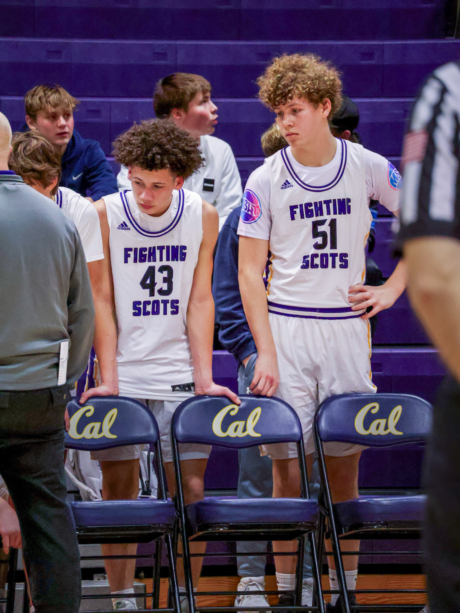 Eyes up, minds sharp—Isaiah Smith and Levell Dunn take in every word as their coach sets the next play. (Photo by Mackenzie Popma)