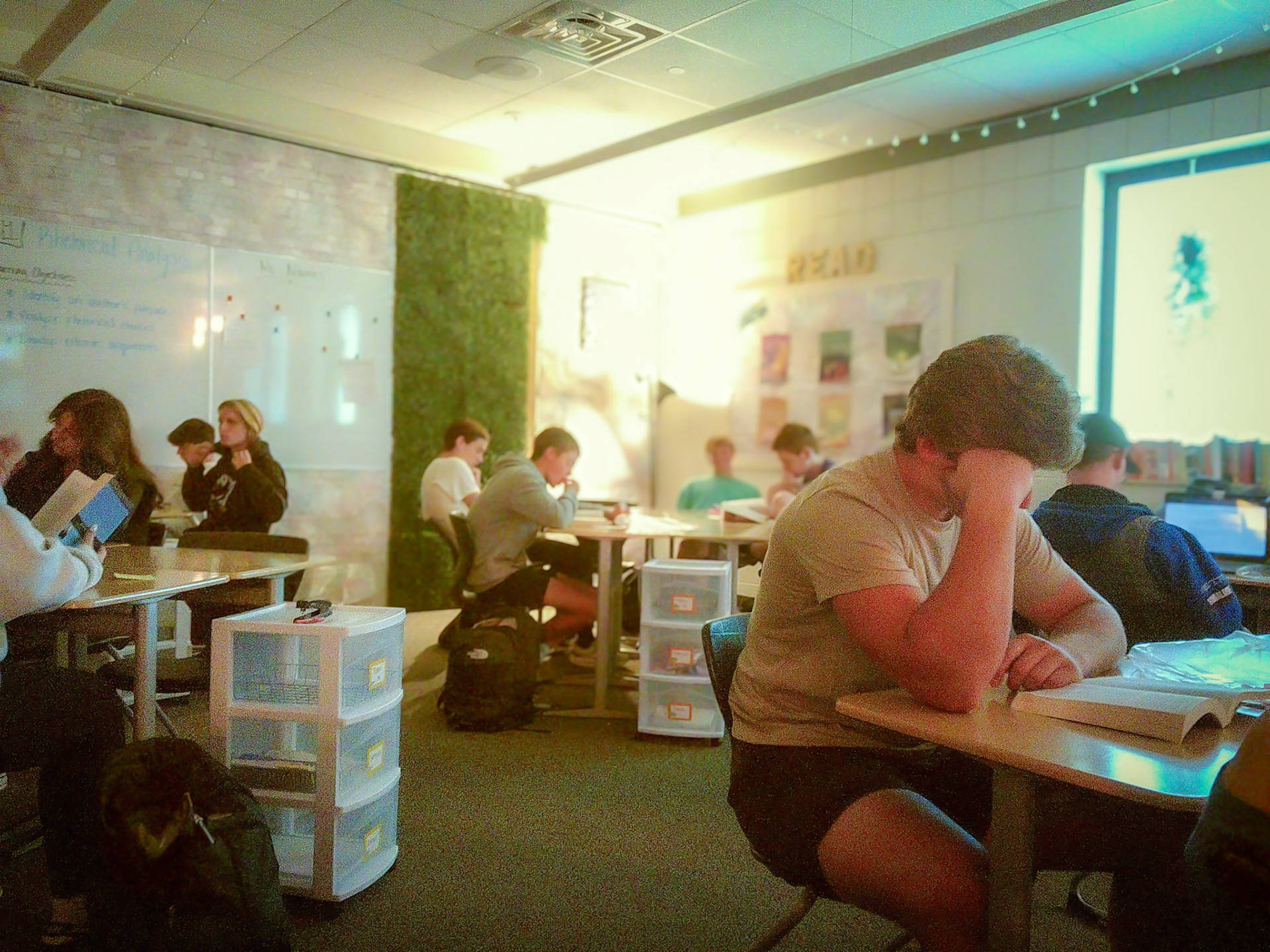 Senior Brent DeYoung dives into his true crime book during Creative Nonfiction Literature. (Photo by Hailey Thayer)