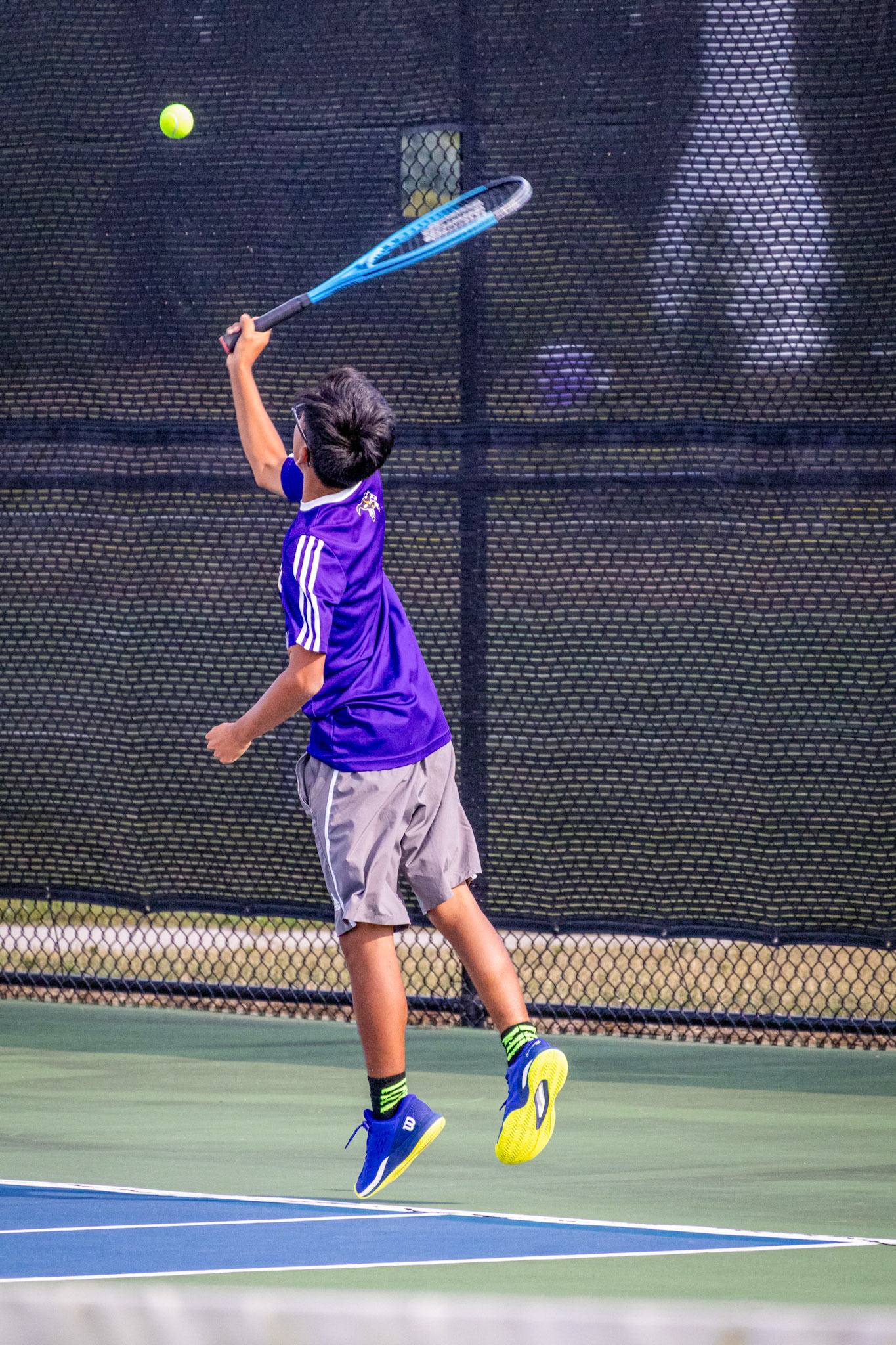 PERFECT TIMING Shane Johnston leaps, ready to deliver a powerful shot that captures the intensity of the match. (Photo by Mackenzie Popma)