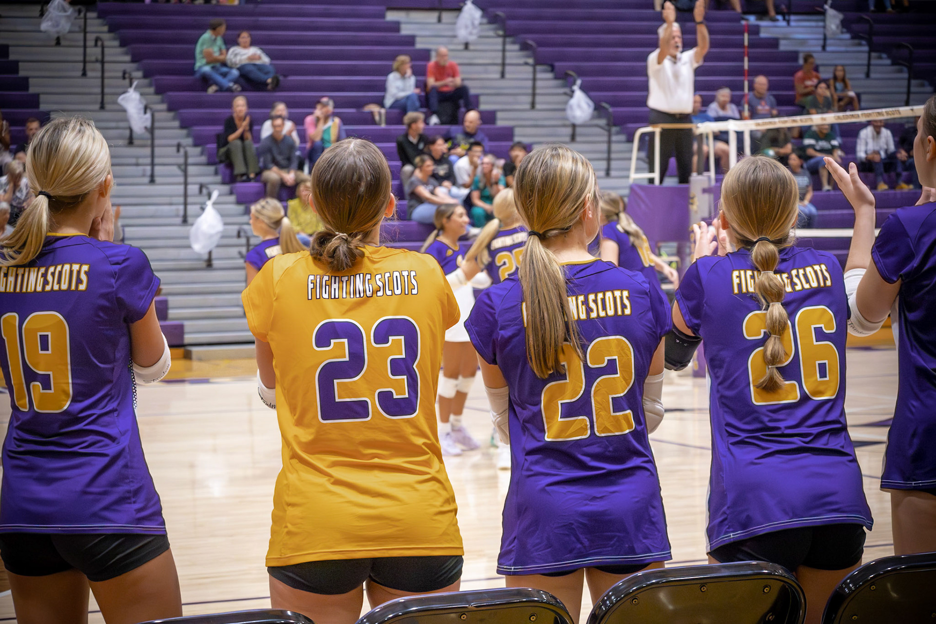 Emma Bowman, Aimee Poe, Myiah Thayer, and Lilliana Klein keep their eyes on the game, fueled by the crowd’s energy. (Photo by Aslyn Crocker)