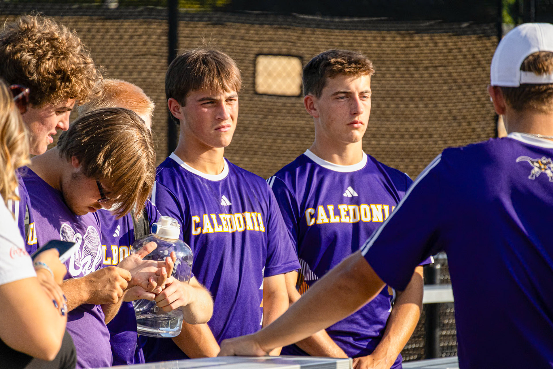 Quinn Stanley and Derrick Prichard listen closely as their coach offers post-match advice. (Photo by Mackenzie Popma)