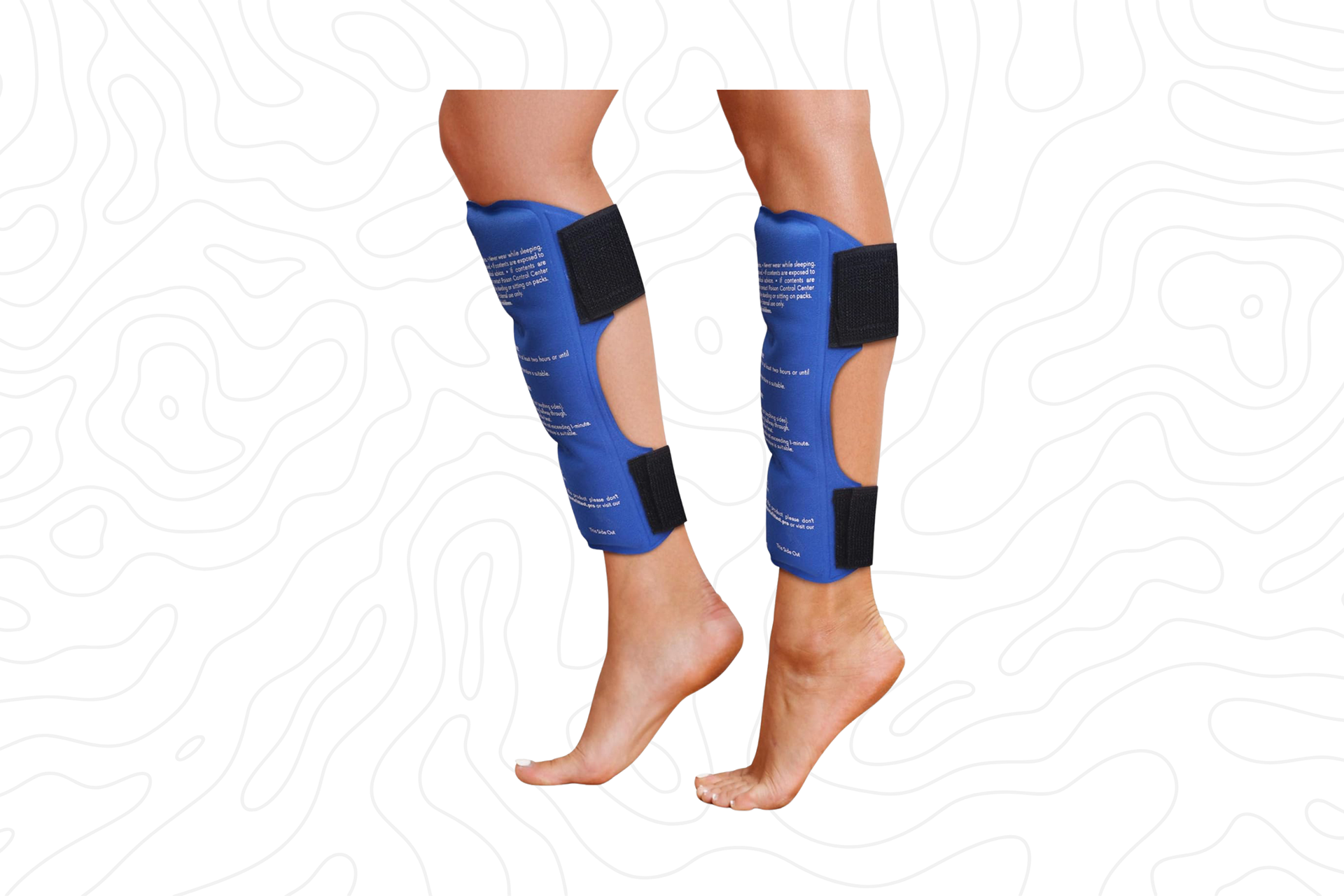 A pair of blue shin splint ice packs with black straps, wrapped around a person's lower legs.