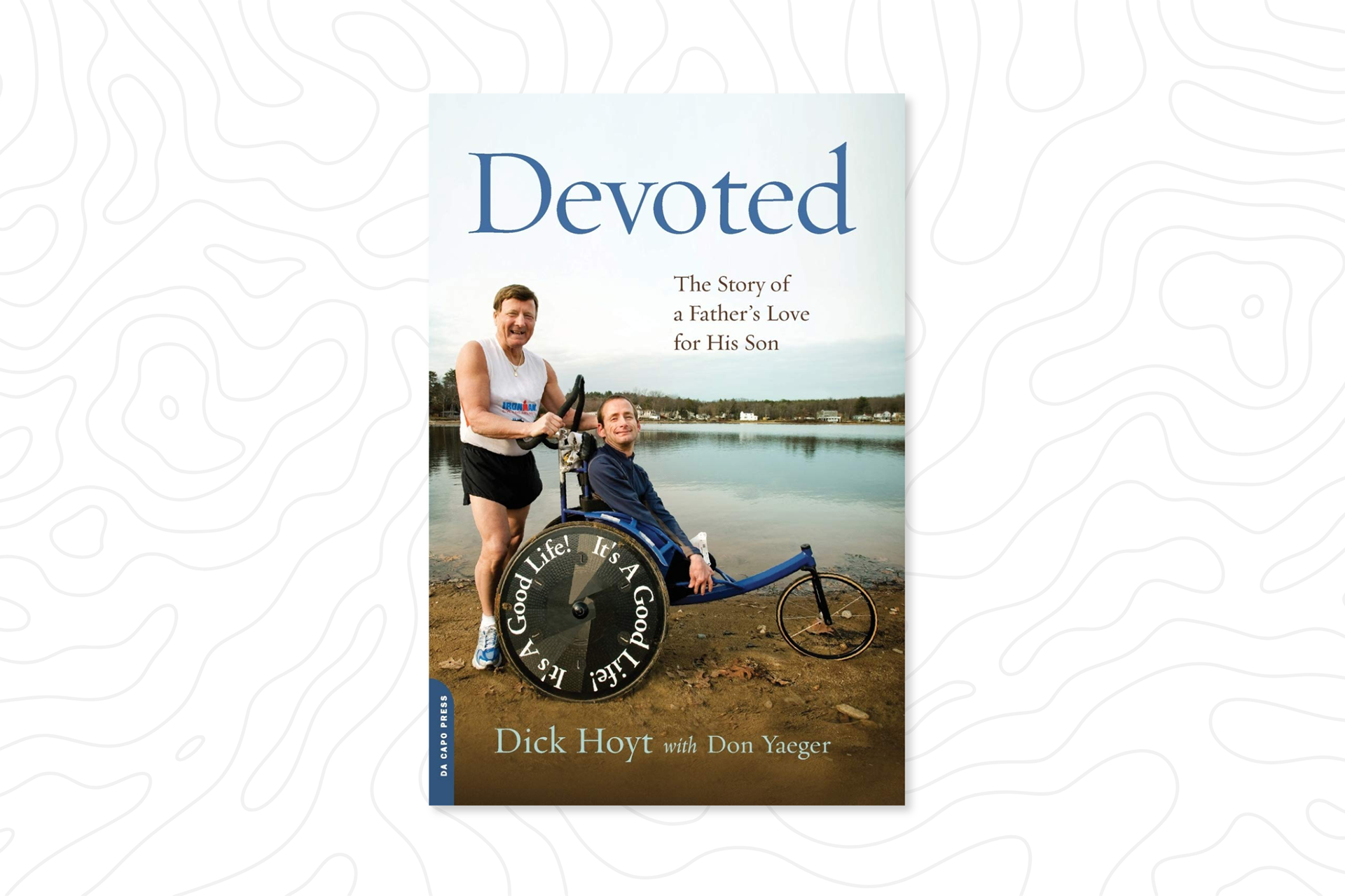 A book cover showing a father and his son in a wheelchair titled “Devoted”, by author Dick Hoyt