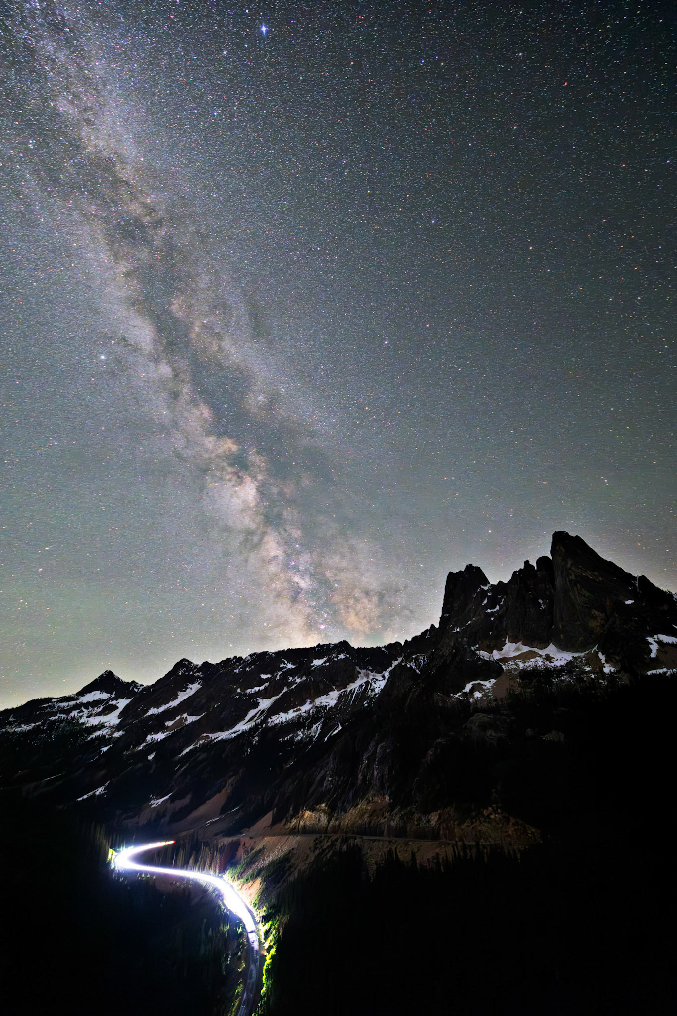 Under the vast North Cascades sky, the Milky Way shines brilliantly above Liberty Rock.