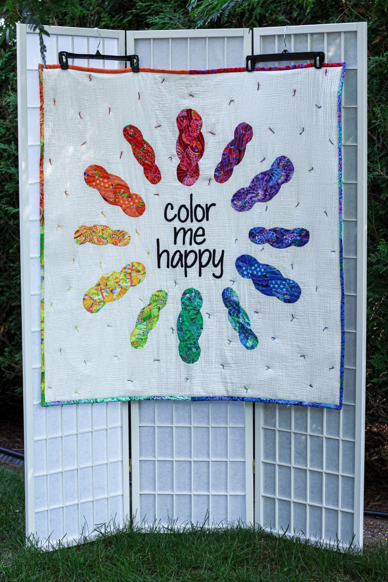 Quilt hanging for Color Me Happy Fiber Arts Studio
