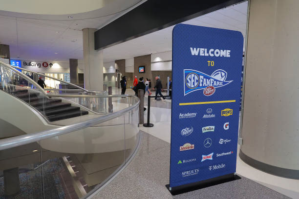 Freestanding branded bannerstand placed throughout fan-access areas(SEC Fanfare) to highlight sponsor partnerships and event messaging.