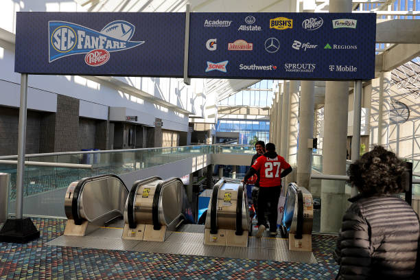 Overhead branded banner designed for visibility across concourse walkways, featuring sponsor integration and SEC Fanfare branding.