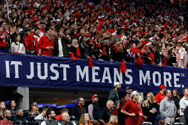 In-game fan environment with field-facing branding on stadium railing.