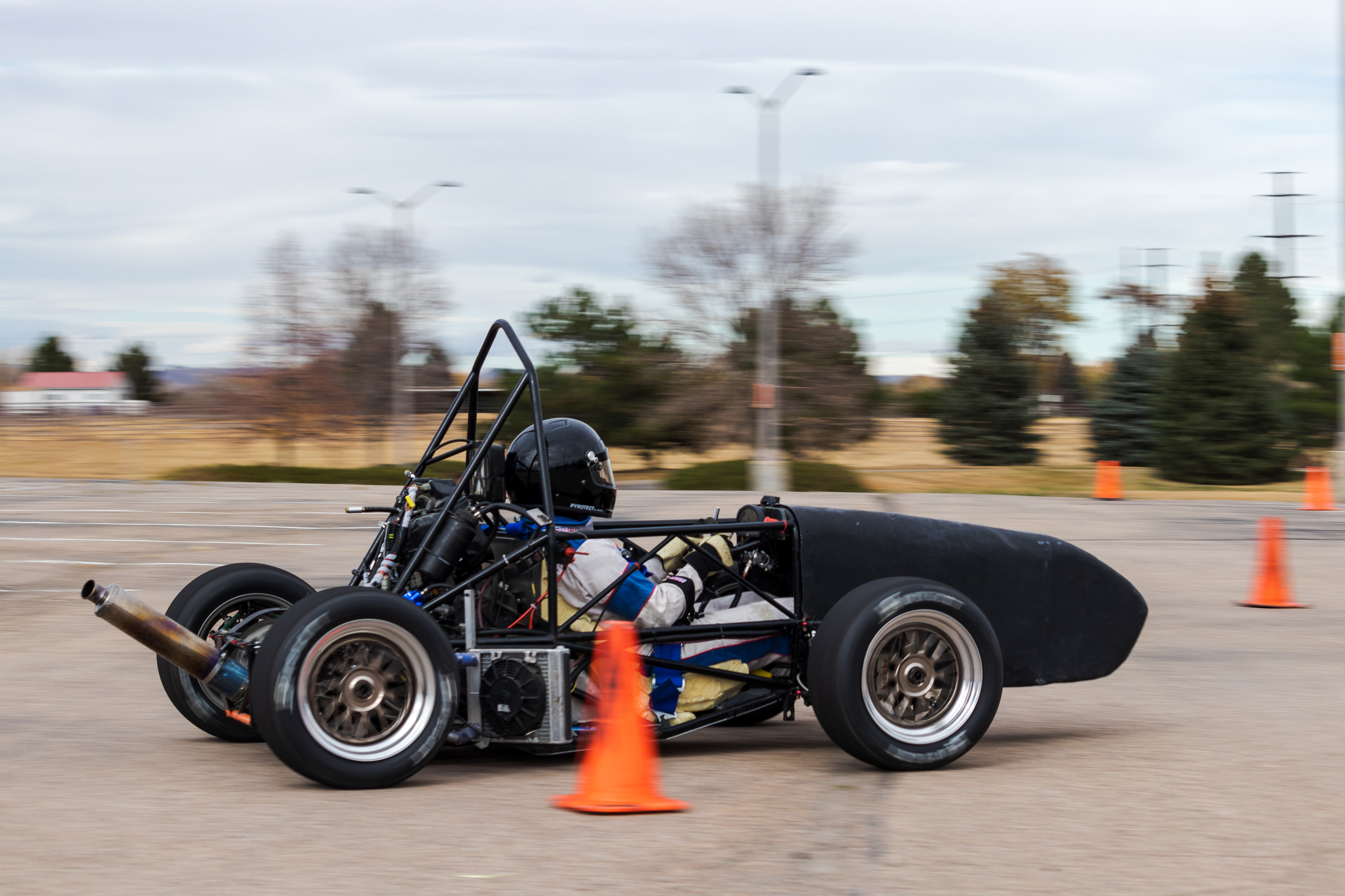 Winn Nana, Racing Driver and Engineer for Ram Racing, drives the team's test car at Colorado State University's Foothills Campus Oct. 30, 2021.. The test car is used for drivers to gain experience while the competition car is unavailable to drive, as well as to evaluate new components. "Last year, we used this car to develop a pneumatic shifting system which we'll be implementing this year," said team advisor Aaron Rabinowitz.