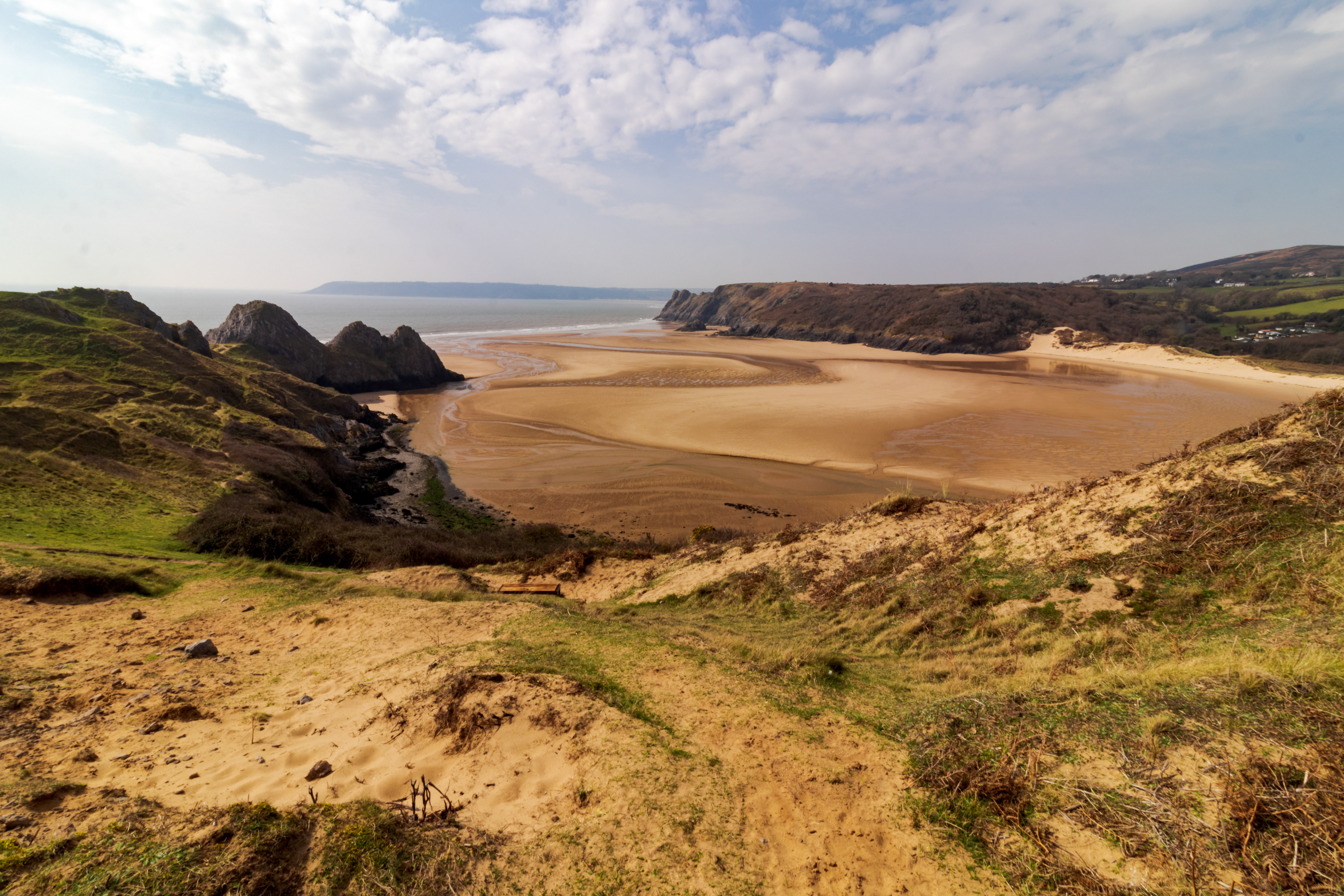Three Cliffs Bay March 21. Located in the Gower peninsula, the United Kingdom's first Area of Outstanding Natural Beauty, Three Cliffs Bay is six miles southwest of Swansea University.