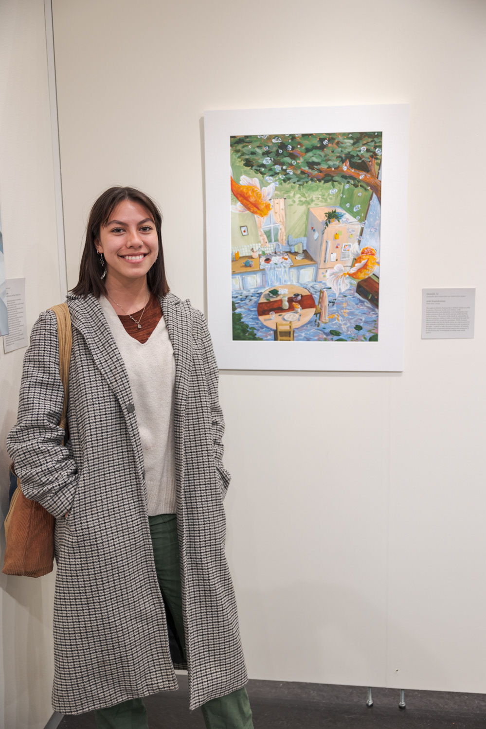 Ariel Sophabmisay shares her painting, "Outside In", at the Colorado State University Student Art Exhibition Nov. 29. "What I'm exploring is the juxtaposition between outdoors and inside and how humans have used the environment to survive," Sophabmisay said. "I chose to represent it in a magical, surrealist way because it's so hard to imagine that the environment could take us over instead of us taking it over." Sophabmisay is a sophomore art student and said she would like to use her degree to study Laotian art because of her family’s heritage.