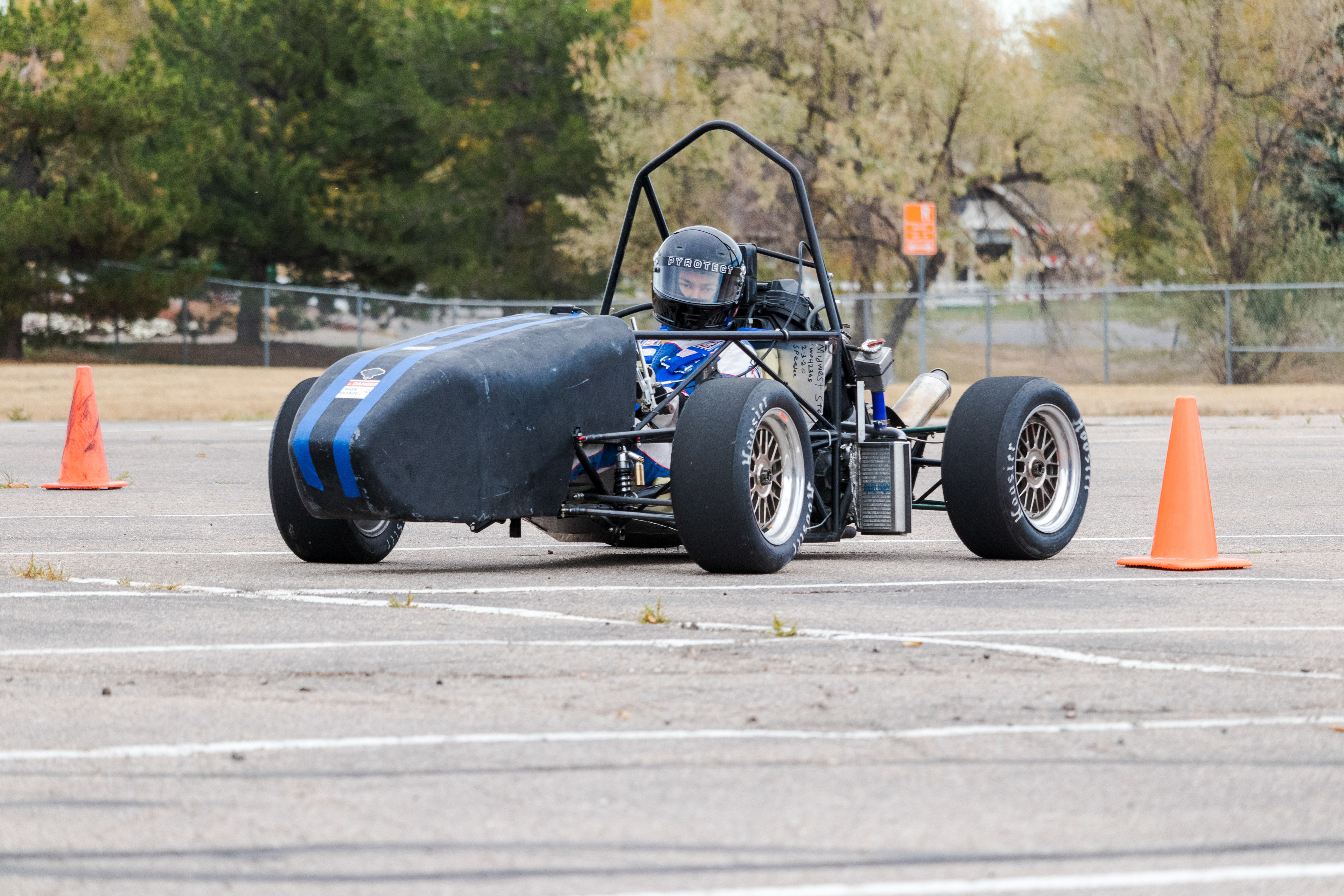 Winn Nana, Racing Driver and Engineer for Ram Racing, drives the team's test car at Colorado State University's Foothills Campus Oct. 30, 2021.. Ram Racing is a student organization at CSU which designs and manufactures race cars for Formula SAE, an international competition sponsored by the Society of Automotive Engineers.