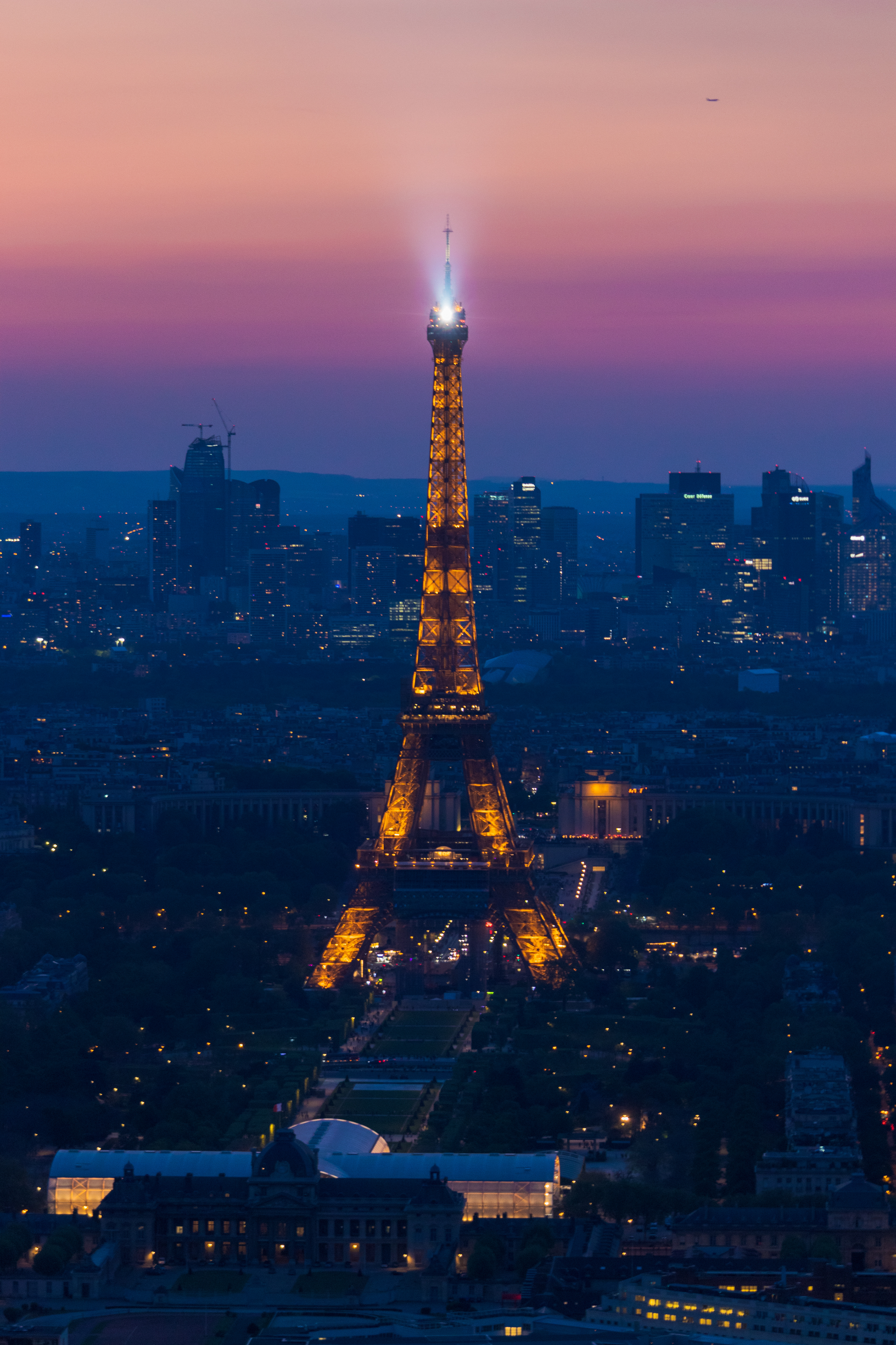 The Eiffel Tower and the skyline of La Défense April 22. Opened in 1889, the Eiffel Tower has become an iconic symbol of Paris, while La Défense is located approximately two miles outside of Paris and is the largest purpose-built business district in Europe.