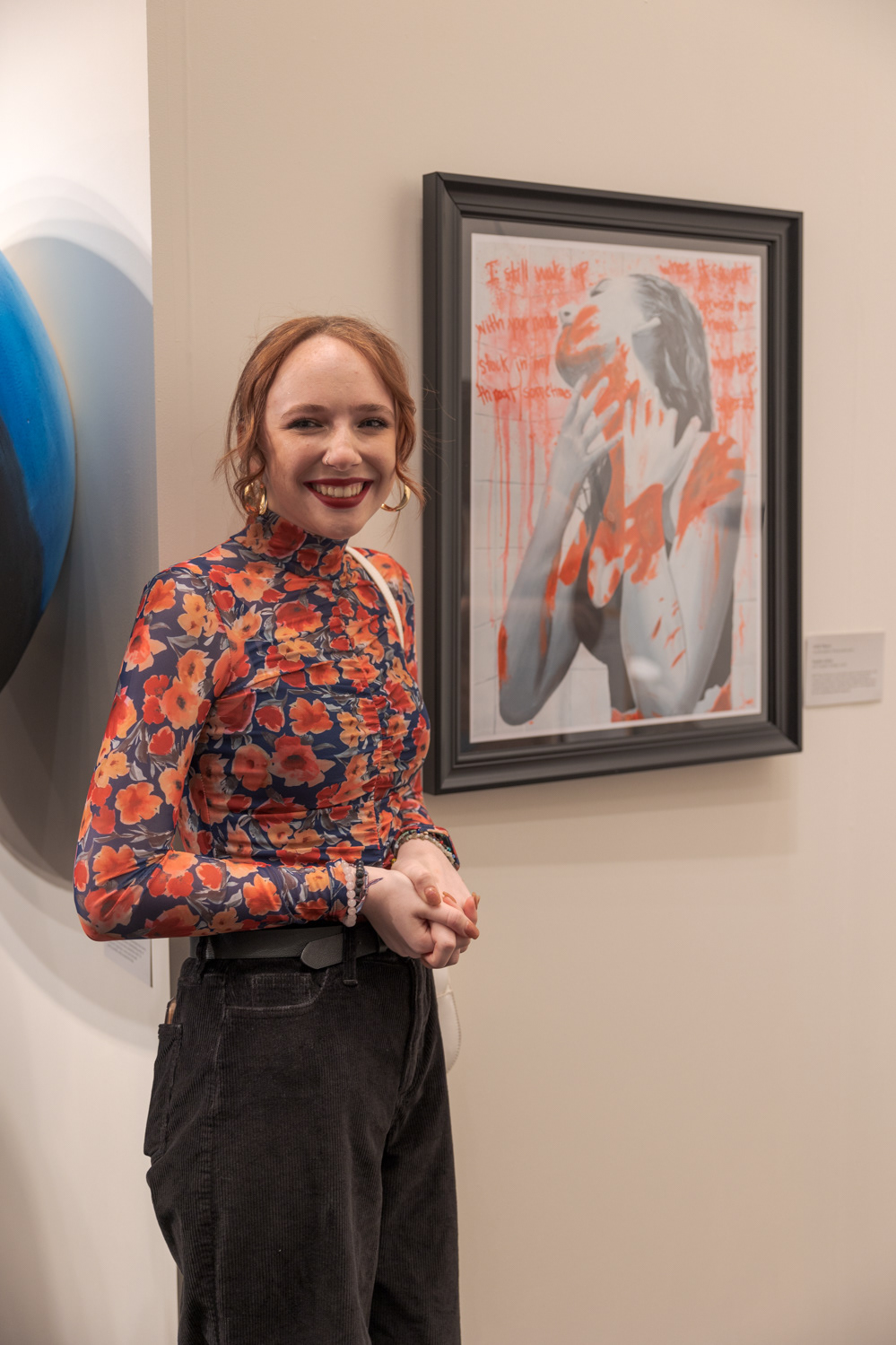 Colorado State University freshman Sophia Galier shares her artwork at the CSU Student Art Exhibition Nov. 29. "This is one of my pieces from my senior AP art portfolio," Galier said. "My art portfolio focused on sexual assault and the aftermath of it. This piece specifically is focusing on directly after the sexual assault and how the red hands, they're not actually there, but even though the assault has already happened, the victim can still feel it. It kind of just represents how sexual assault is not something that goes away easily and it sticks with you."