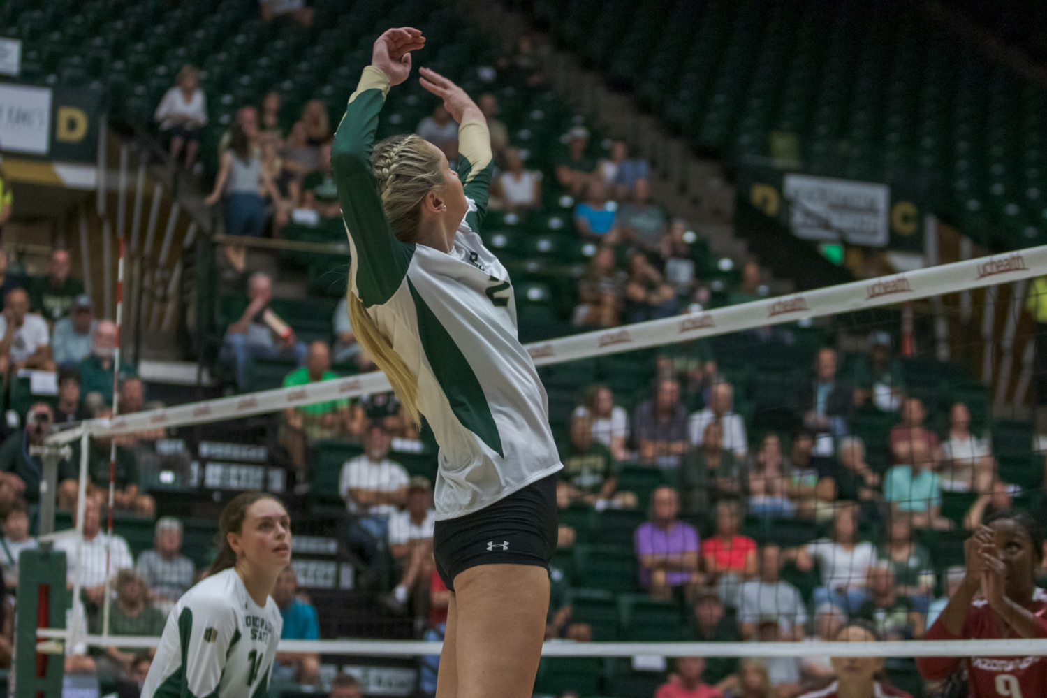 Colorado State University Outside Hitter Annie Sullivan (2) jumps to spike the ball during the game against the University of Arkansas Sept. 1, 2022. Arkansas won 3-0.