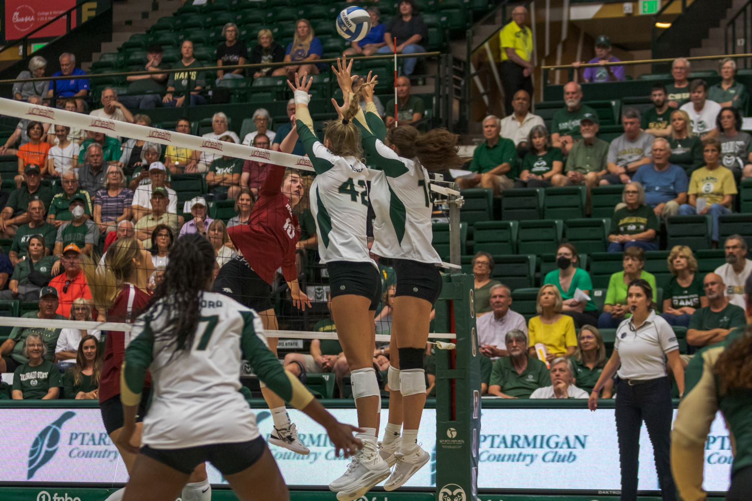 Colorado State University Middle Blocker Karina Leber (42) and Opposite Alyssa Groves (14) jump to block the ball during the game against the University of Arkansas Sept. 1, 2022. Arkansas won 3-0.