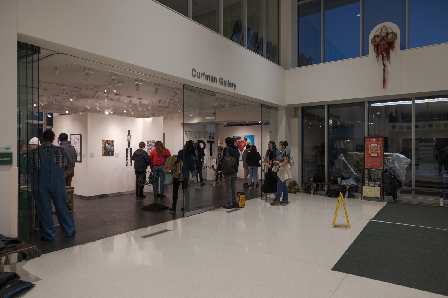 A crowd gathers at the Curfman Gallery in Colorado State University's Lory Student Center for the Student Art Exhibition Nov. 29. The exhibit features 44 pieces of art and will run until January 27.