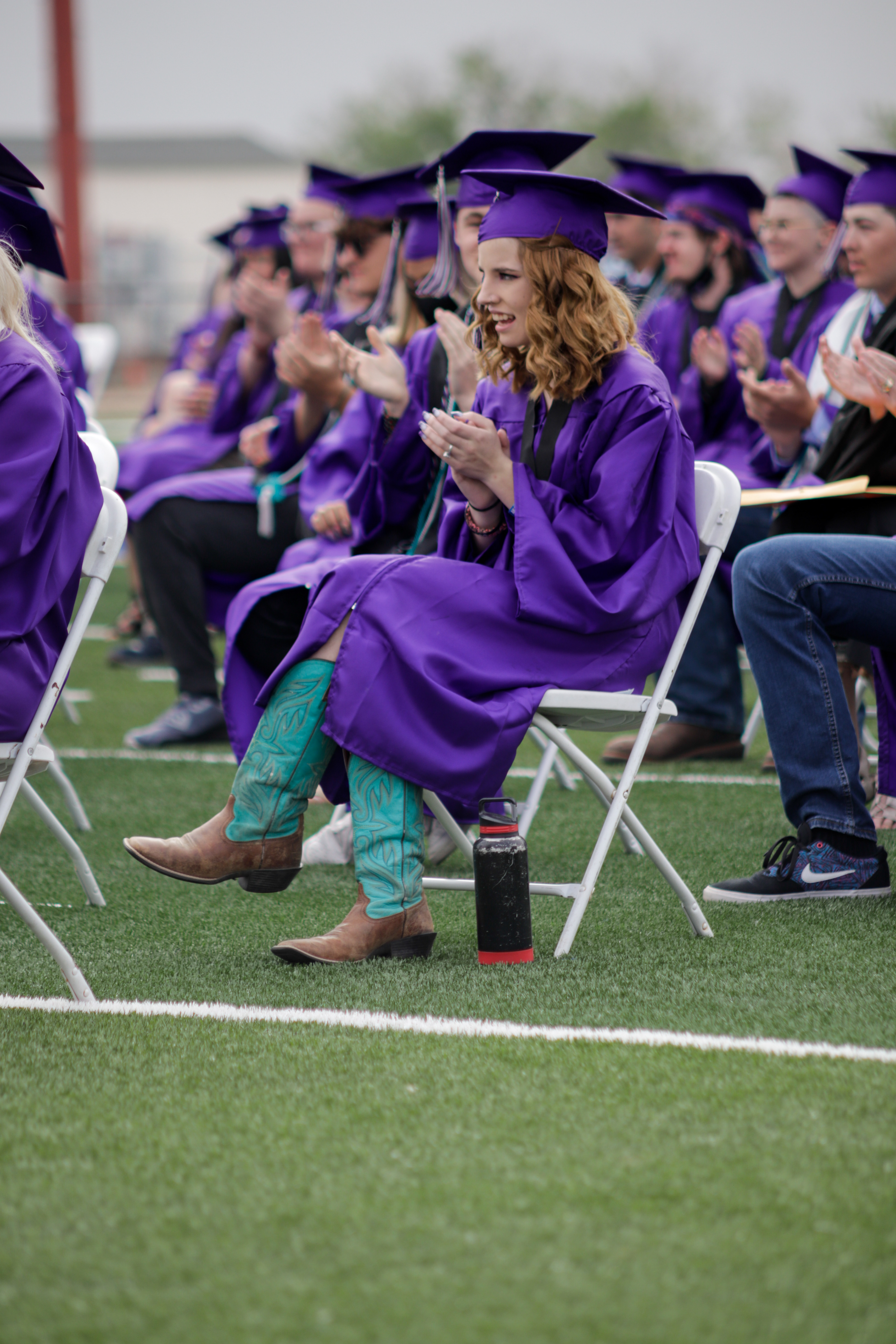 LOVELAND, CO - MAY 29, 2021: Mountain View graduate Cadence Dean applauds during the Valedictorian's Welcome speech at her graduation ceremony Saturday, May 29, 2021 at Patterson Field in Loveland. (Michael Marquardt/Loveland Reporter-Herald)