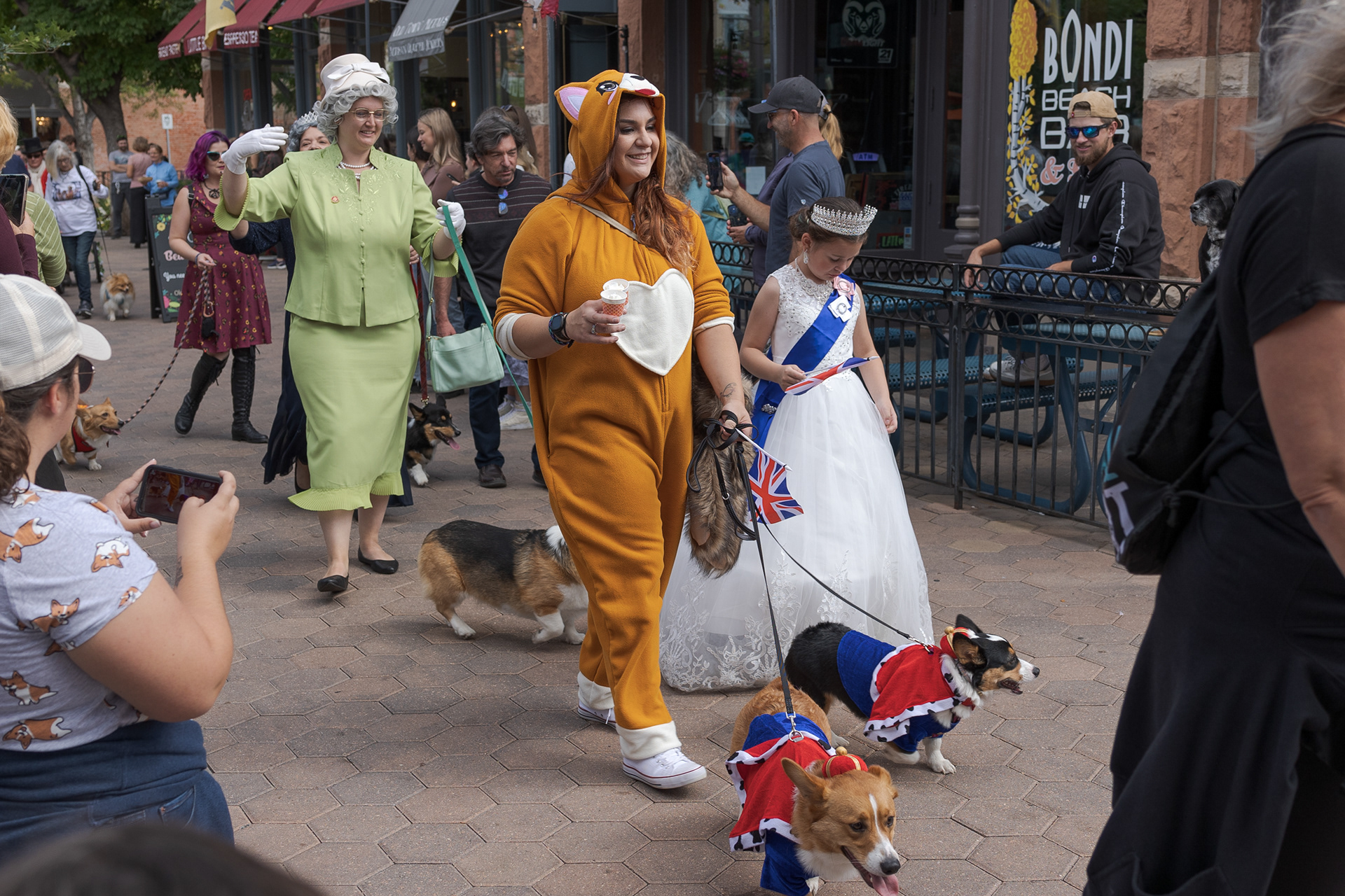 Corgis parade through Old Town Square during Tour de Corgi Oct. 1. The event started with a costume contest in Civic Center Park and ended with a parade through Old Town.