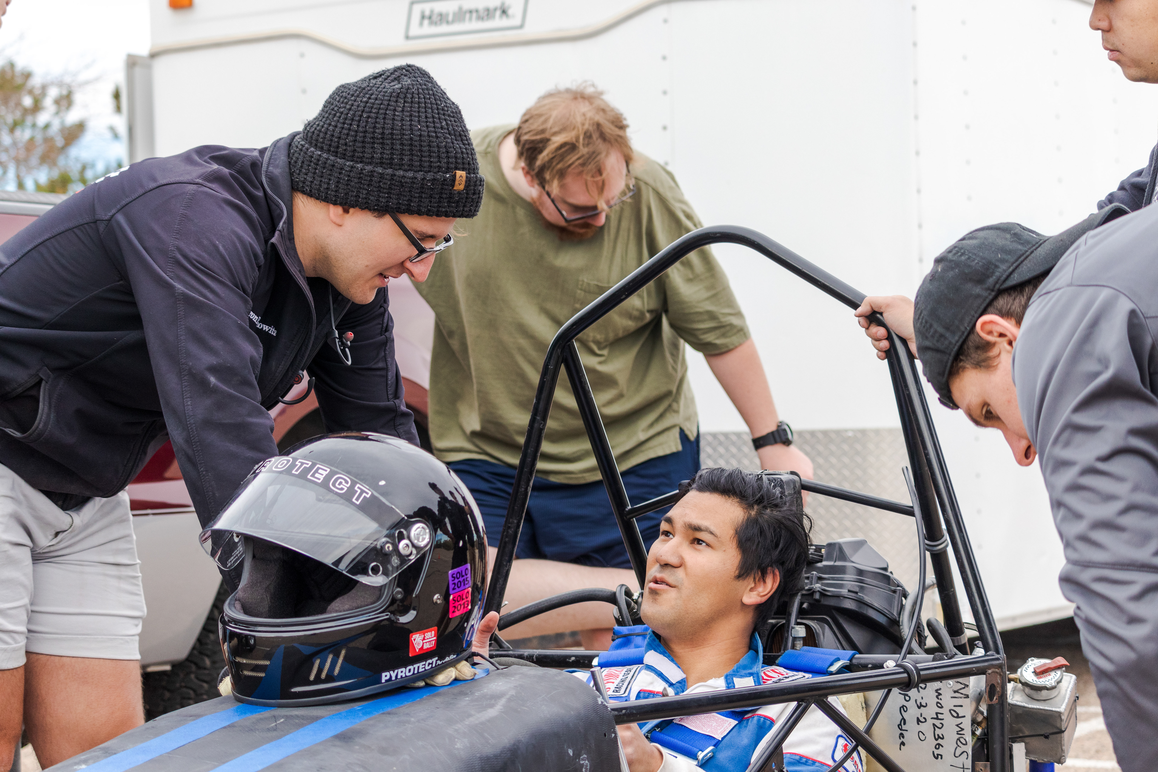 Winn Nana, Racing Driver and Engineer for Ram Racing, discusses results of the team's first test run of the season with team advisor Aaron Rabinowitz (left) Oct. 30, 2021.. "I think the suspension's a little too stiff," said Nana. "When I turn, I have to wrestle with it a little bit... When it comes to a bit bigger track, that might have to be something that we look into. "