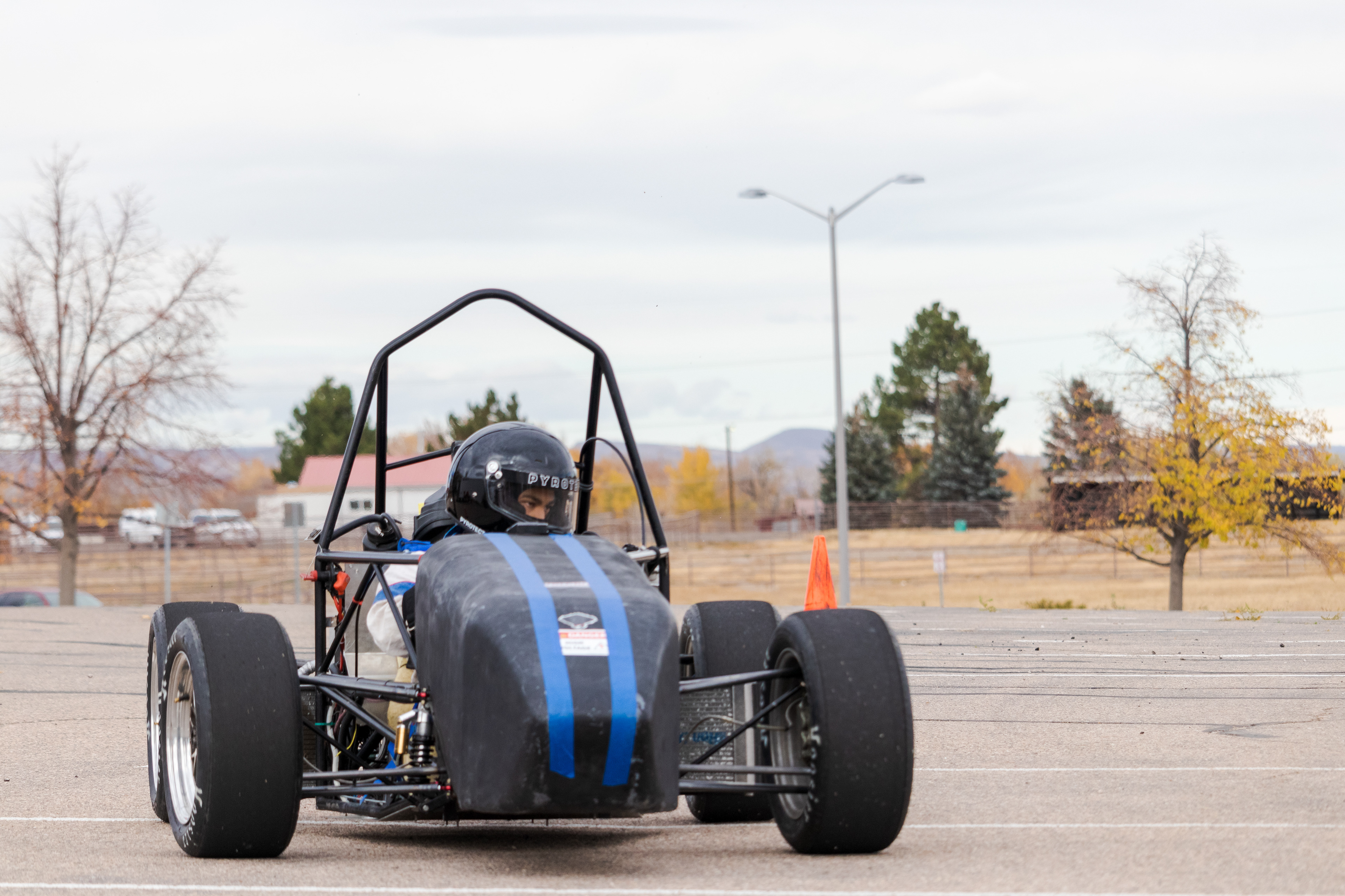 Winn Nana, Racing Driver and Engineer for Ram Racing, drives the team's test car at Colorado State University's Foothills Campus Oct. 30, 2021.. The test car is used for drivers to gain experience while the competition car is unavailable to drive, as well as to evaluate new components. "Last year, we used this car to develop a pneumatic shifting system which we'll be implementing this year," said team advisor Aaron Rabinowitz.