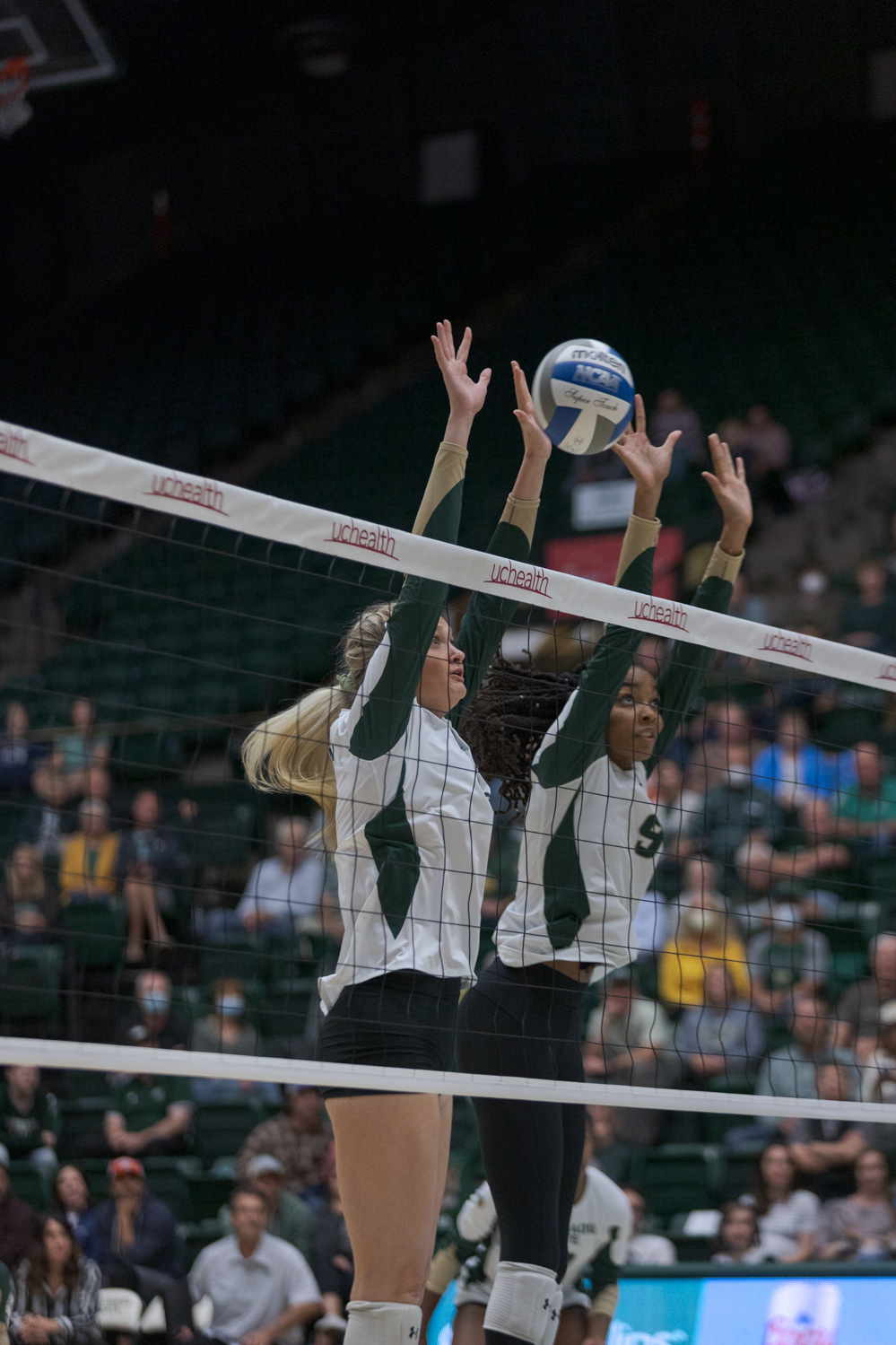 Colorado State University Outside Hitter Annie Sullivan (2) and Middle Blocker Naeemah Weathers (9) block the ball during the volleyball game against the University of Nevada, Reno Oct. 6, 2022. CSU won 3-0.