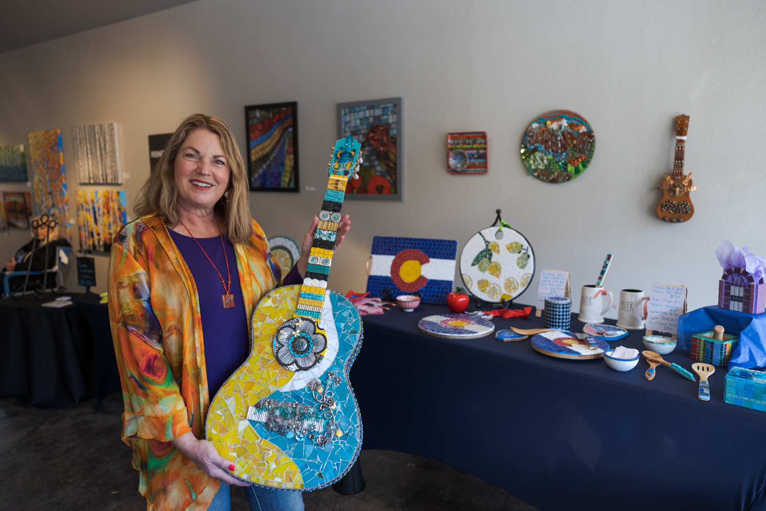 Renee Walkup poses with her artwork at the Local Women Artists Market at Art Lab Nov. 5. "I've always loved mosaics, but I didn't know how (to do them)," Walkup said. "My dream was moving to Colorado about six years ago, and then I had no idea I was going to love it and it would become all-encompassing. I live, read, eat, sleep, everything mosaic."