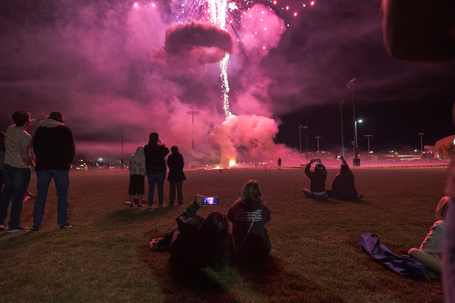 Colorado State University community members record video of the fireworks show on campus during Friday Night Lights Oct. 14, 2022.