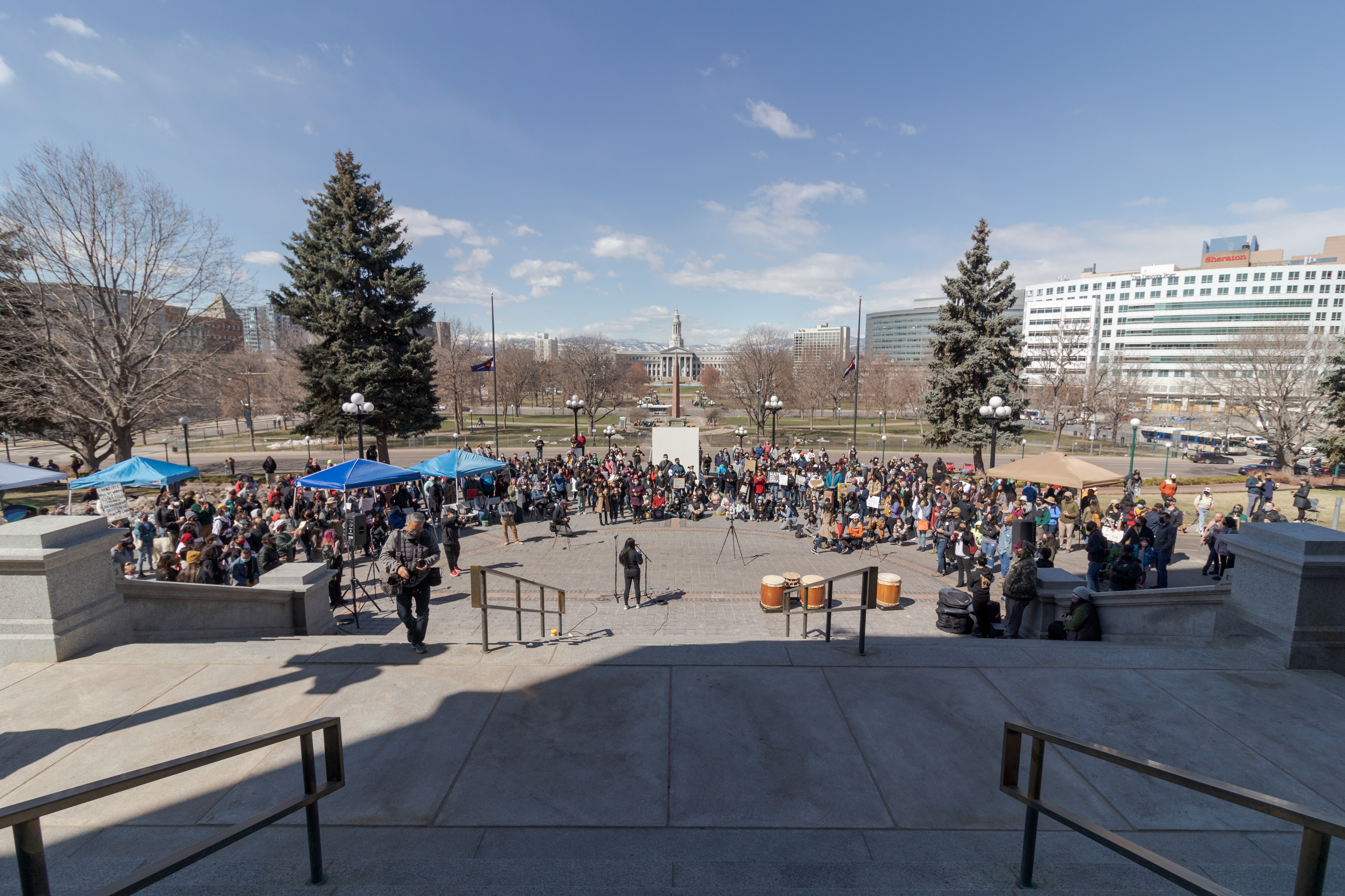 Protesters gather outside the Colorado State Capitol March 27.  The protest featured speeches, poetry, and music from the Asian-American and Pacific Islander community.