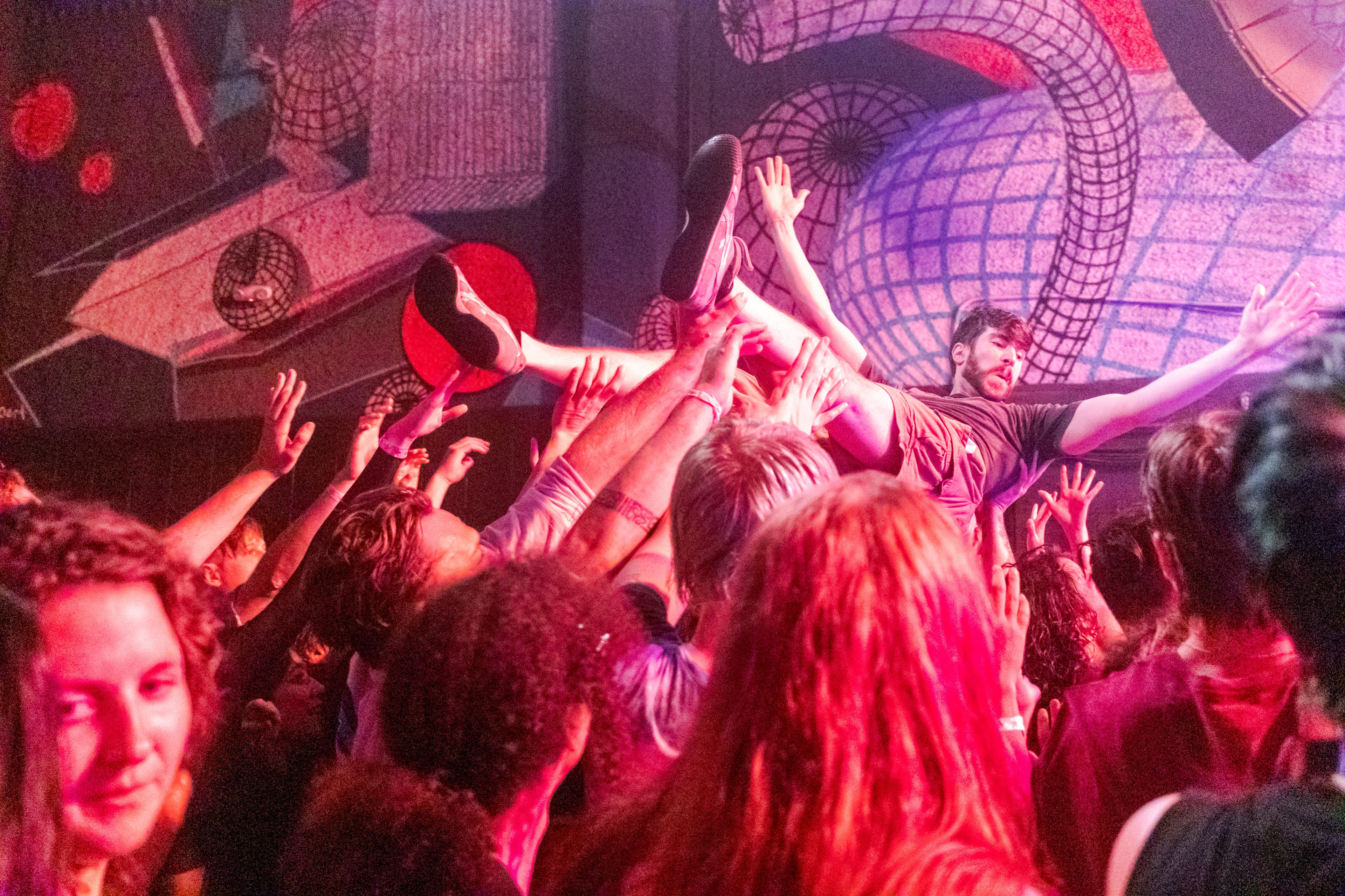 Mike Davis, drummer and backing vocalist for Chess at Breakfast, crowd surfs during the Farewell World Tour concert at the Aggie Theatre July 2.