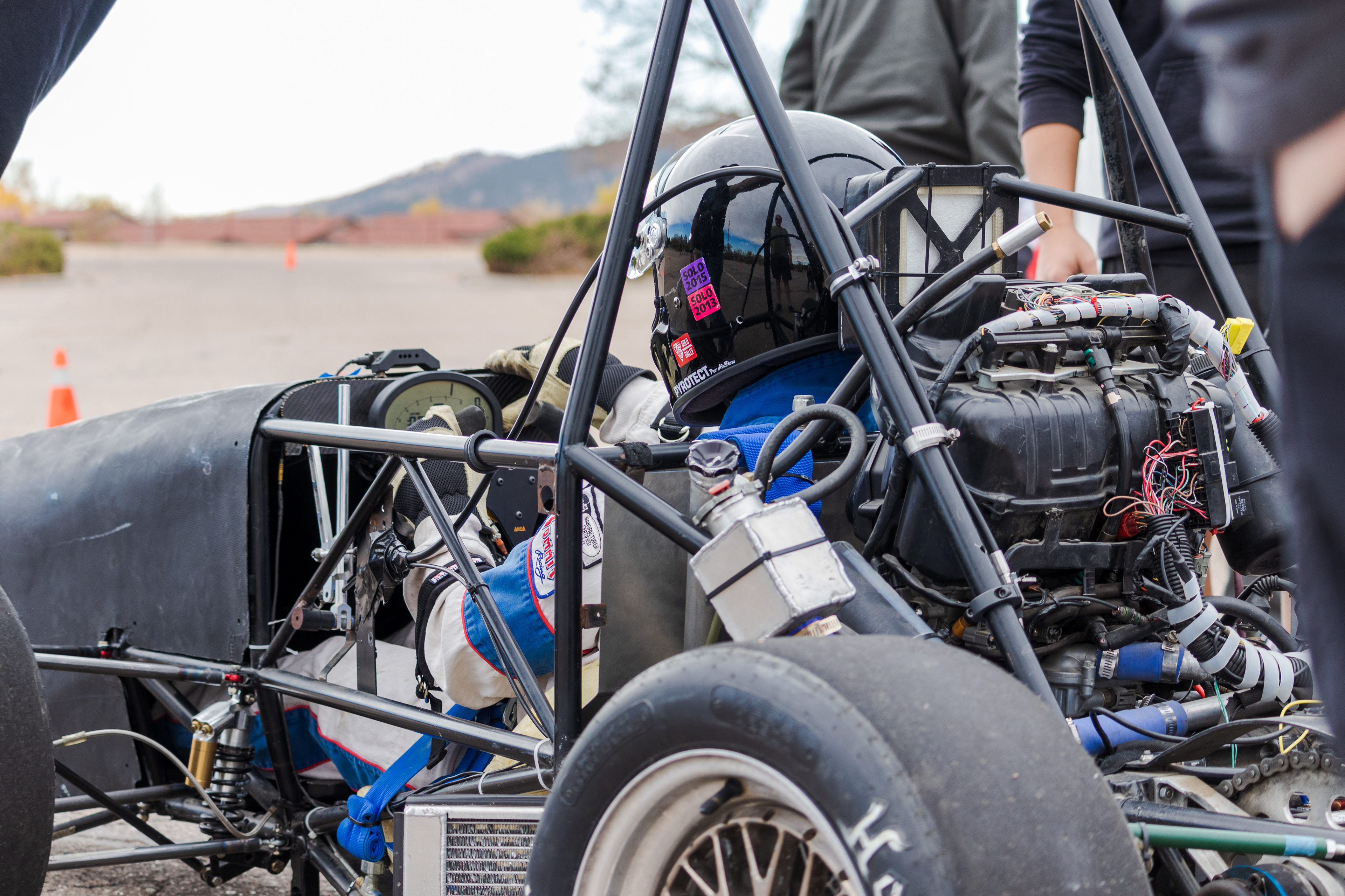 Winn Nana, Racing Driver and Engineer for Ram Racing, prepares to drive the team's test car at Colorado State University's Foothills Campus Oct. 30, 2021.. Ram Racing is a student organization at CSU which designs and manufactures race cars for Formula SAE, an international competition sponsored by the Society of Automotive Engineers.