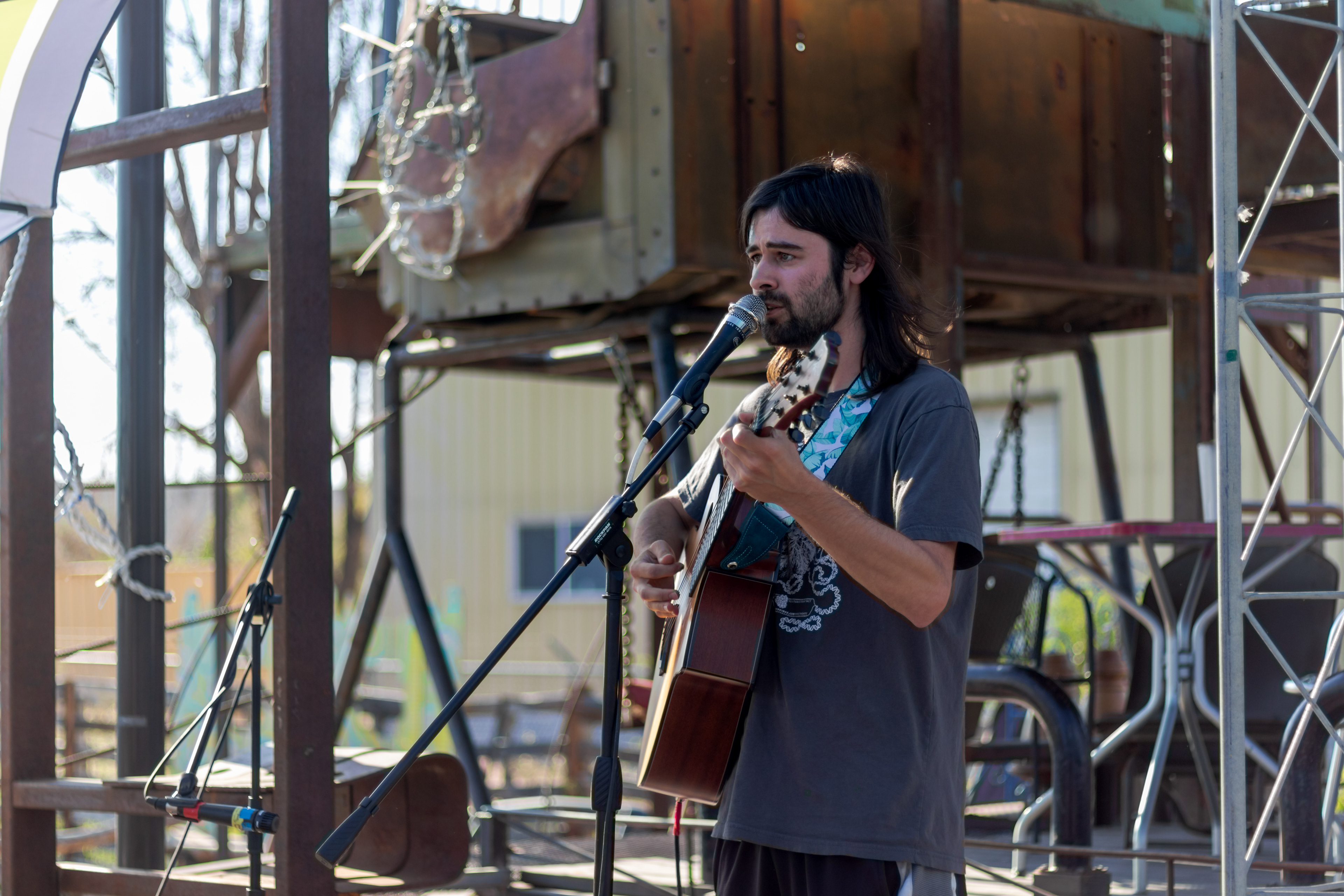 Jay LeCavalier performs at The Lyric's open mic night June 14. LeCavalier, whose band, The Crooked Rugs, performed at the Aggie Theatre June 12, spoke about The Lyric's Summer Solstice Festival before performing a series of original songs.
