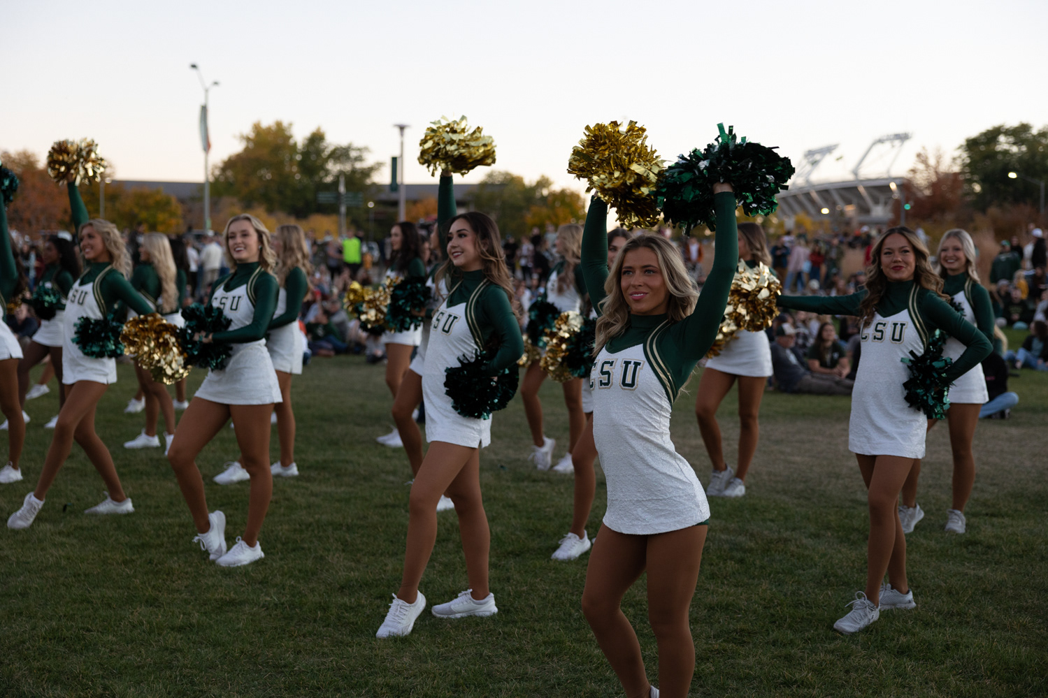 Colorado State University cheerleaders perform at Friday Night Lights Oct. 14, 2022. Part of CSU's homecoming week, the event featured performances from cheerleaders and the marching band, as well as speeches from sports coaches, a bonfire, a fireworks show and a DJ set on the Lory Student Center west lawn.