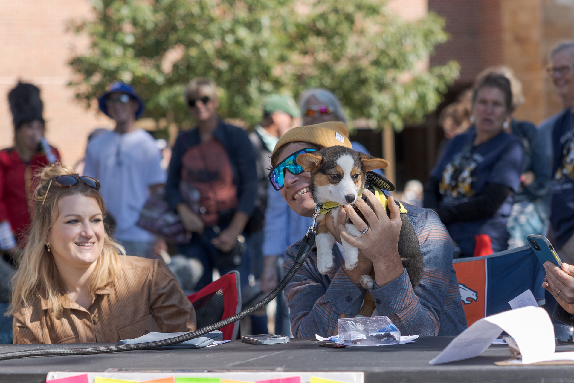 Tour de Corgi costume contest judges pose with Olive, the runner-up for "Purdiest Corgi", Oct. 1.