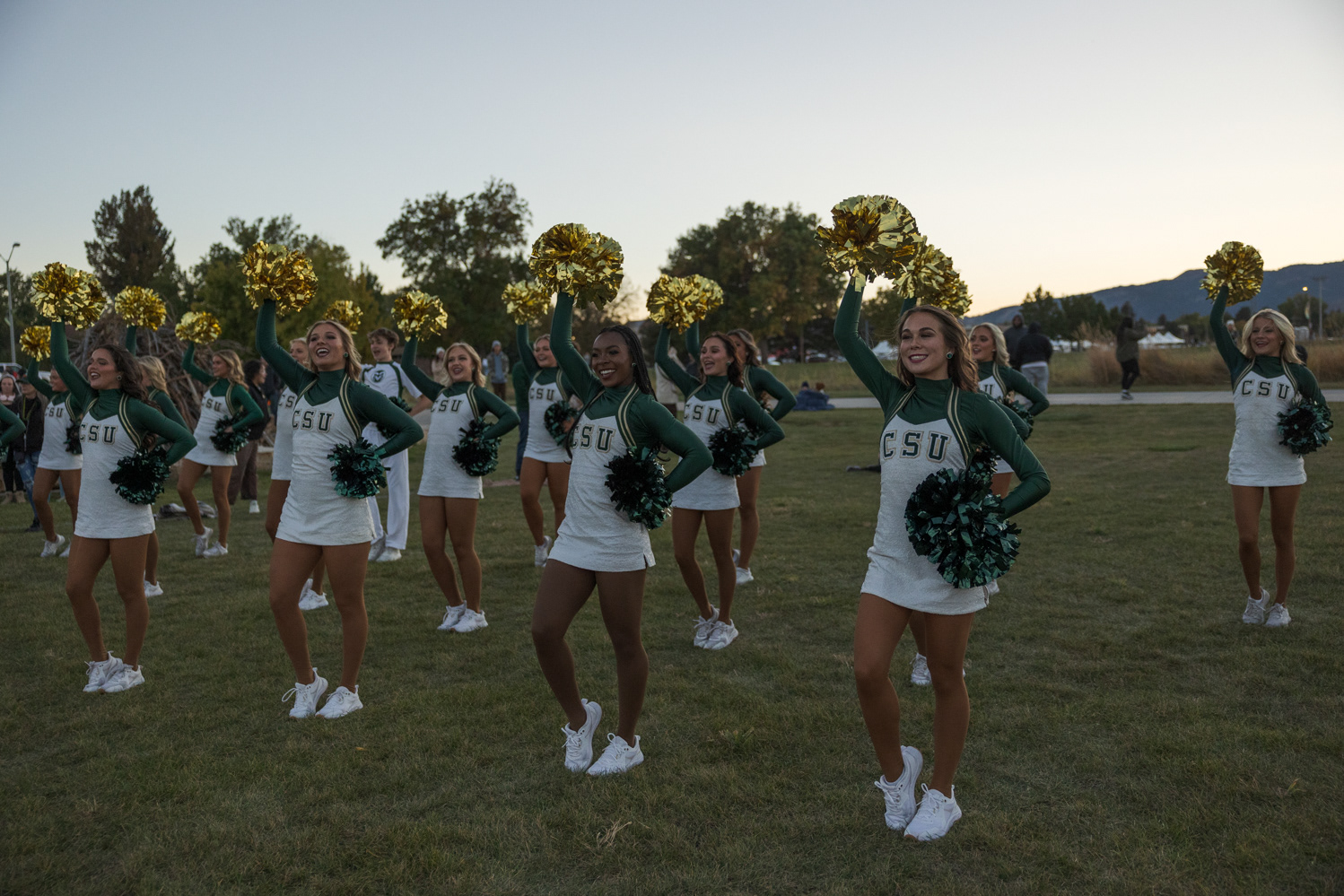 Colorado State University cheerleaders perform at Friday Night Lights Oct. 13. Part of CSU's homecoming celebration, the event features performances from the marching band, color guard and cheerleaders, as well as speeches from sports coaches, a bonfire, fireworks and a DJ performance.