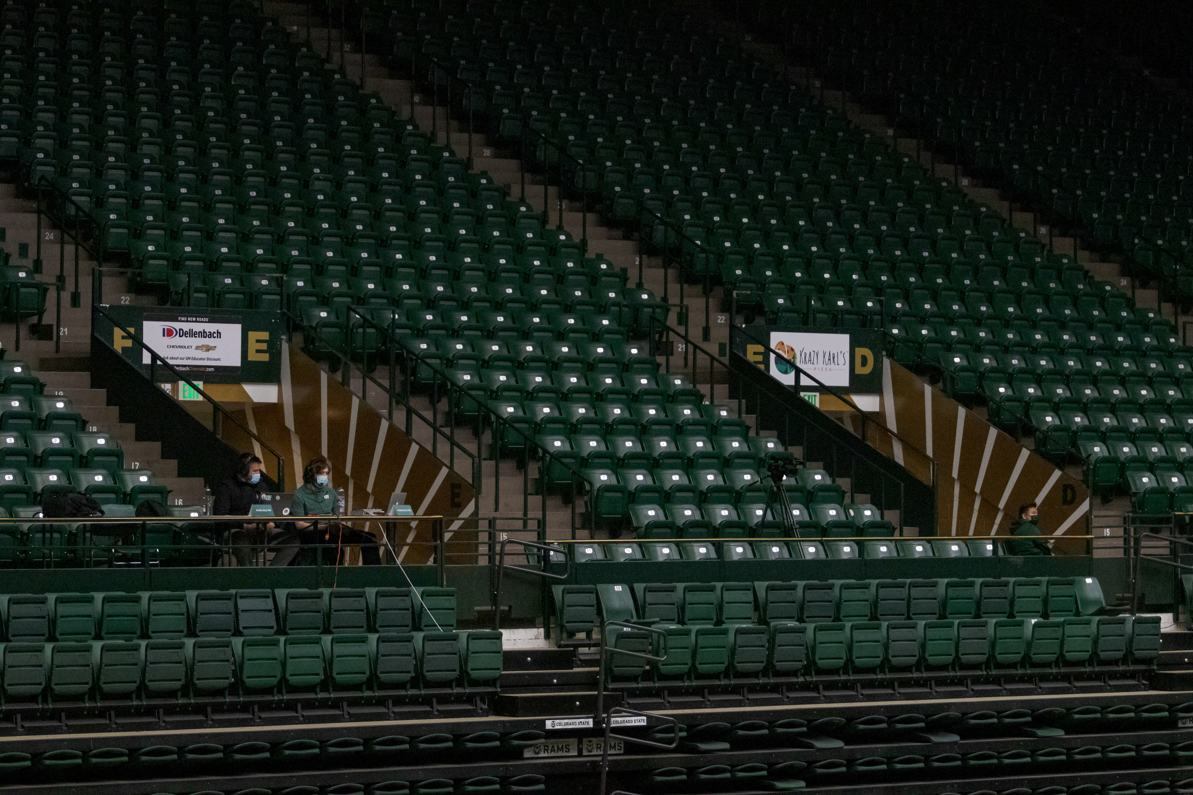 KCSU radio broadcasters sit in front of empty seats in Moby Arena during the Colorado State University versus Boise State University women's volleyball match March 25, 2021.