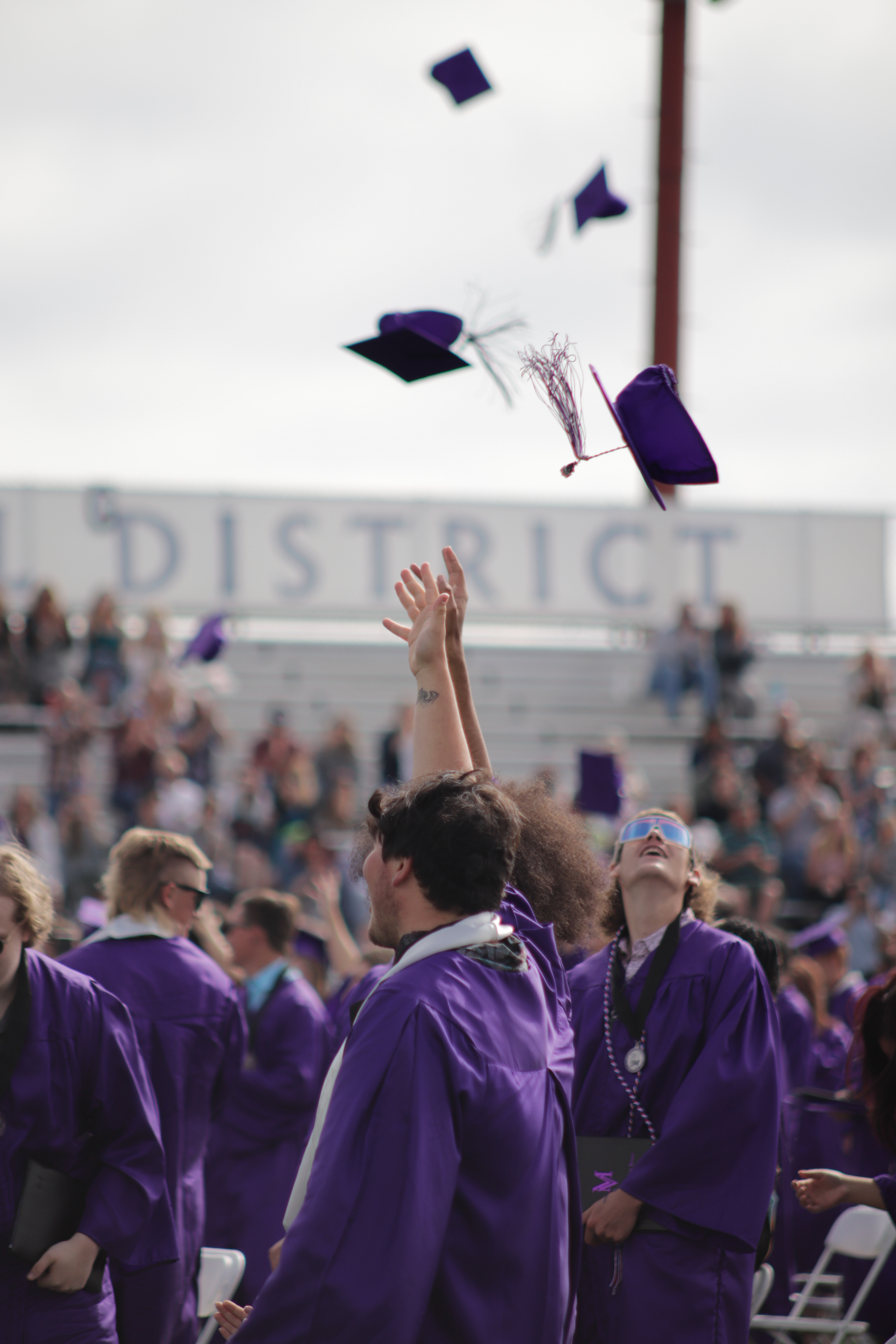 LOVELAND, CO - MAY 29, 2021: Mountain View graduates throw their caps in the air after their graduation ceremony Saturday, May 29, 2021 at Patterson Field in Loveland. (Michael Marquardt/Loveland Reporter-Herald)