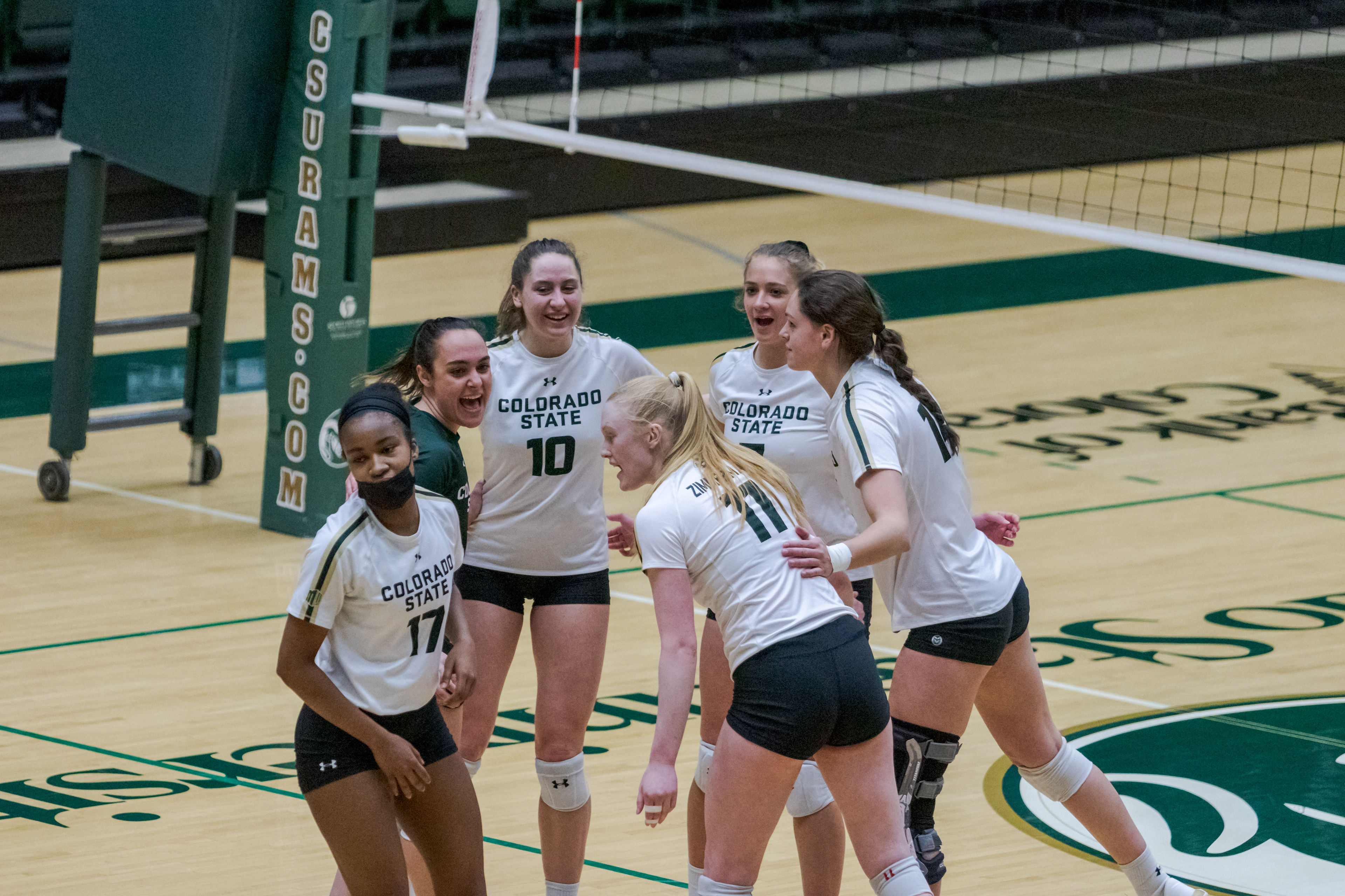 Colorado State University women's volleyball athletes celebrate after scoring on Boise State University March 25, 2021. CSU won 3-1.