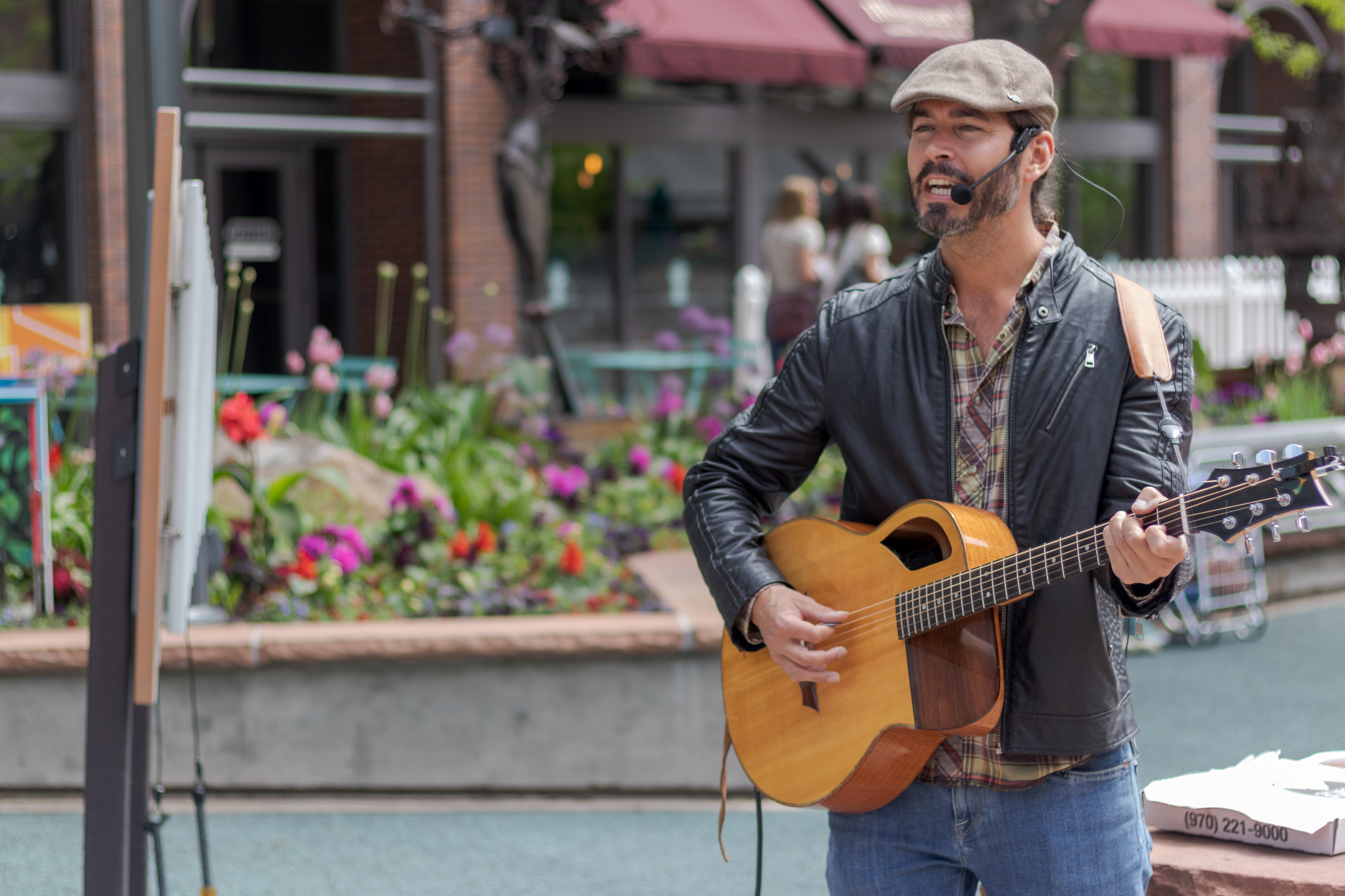 Singer and guitarist Daniel Ondaro performs in Old Town Square May 31. Ondaro, who has played guitar for "maybe twenty years," says his favorite part of performing is "seeing the audience's reaction, seeing the smiles".